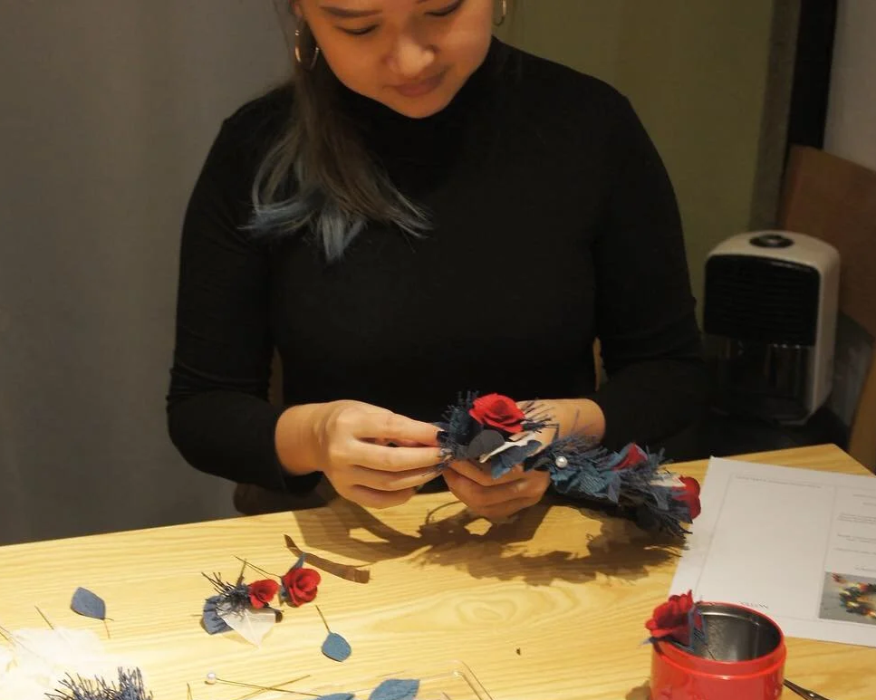 Singaporean student attending handmade Christmas wreath (made with paper) in Seoul Korea.