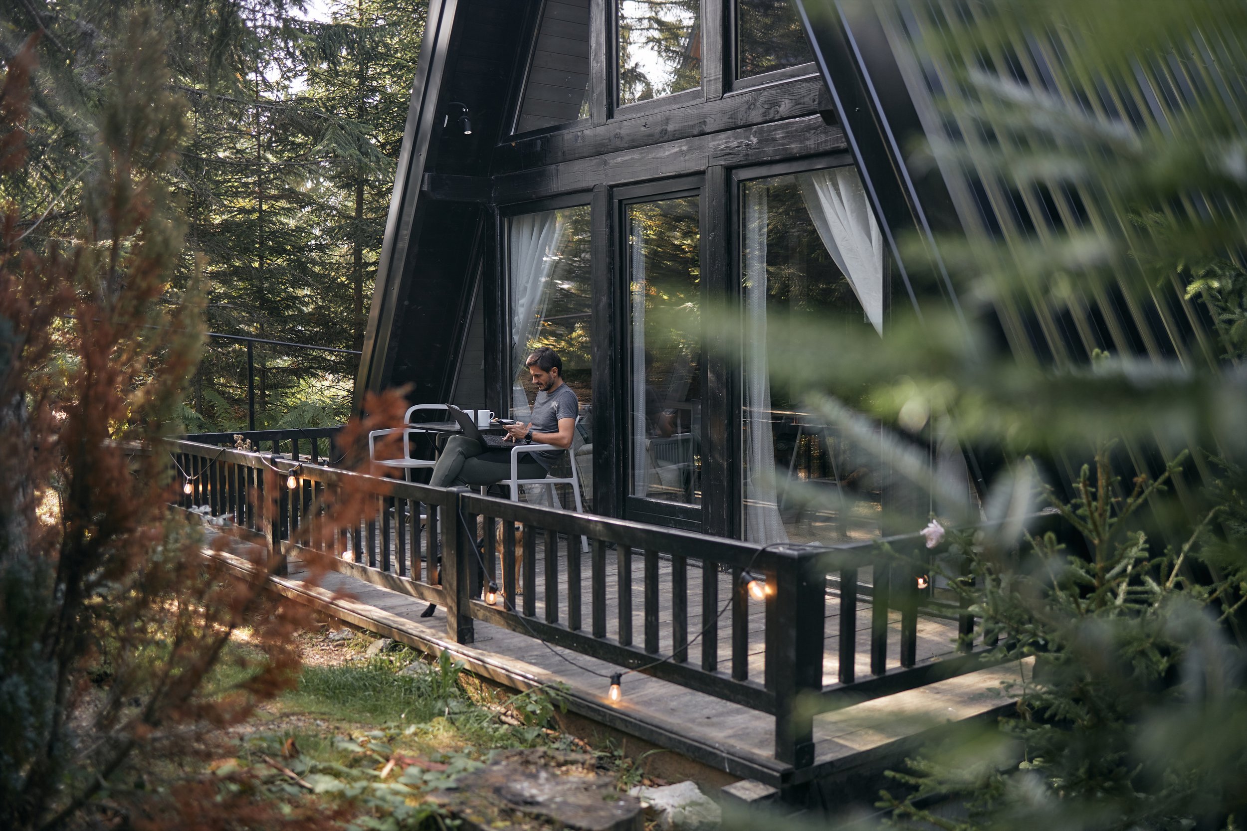 Cabin deck with man on computer