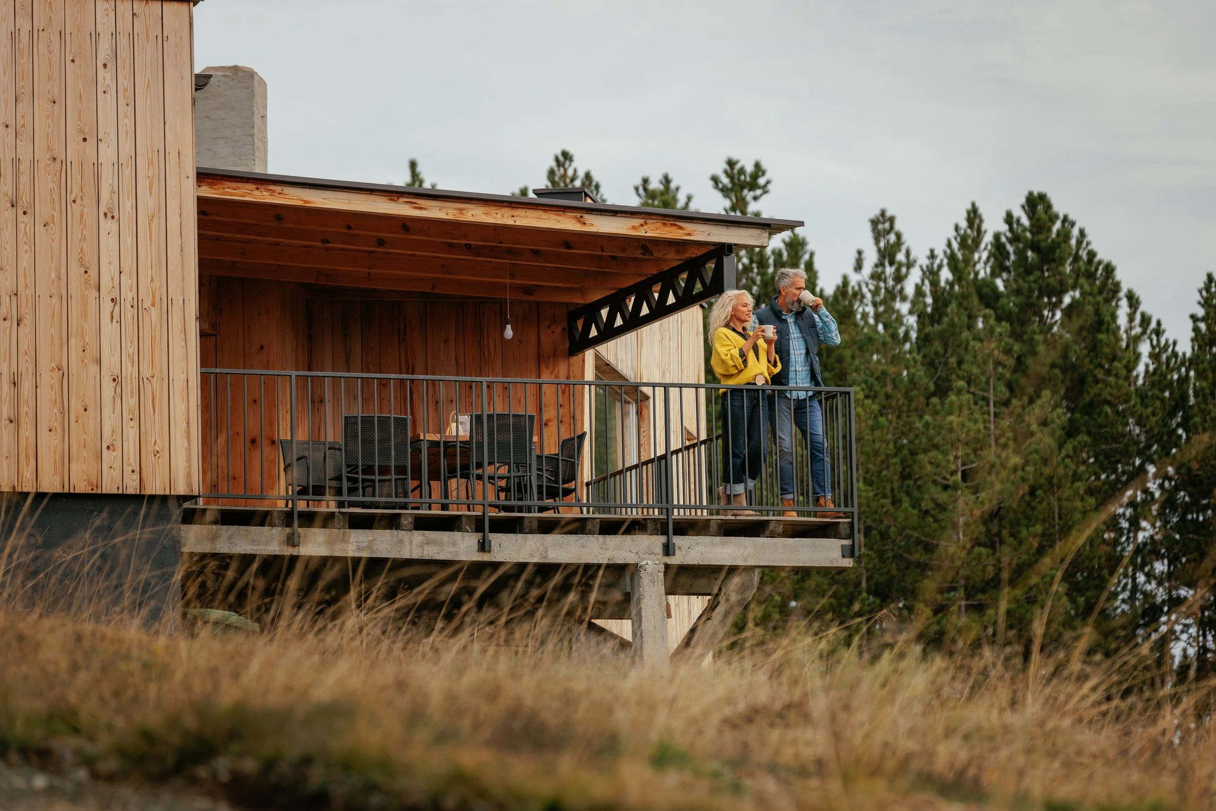 couple on back deck taking in the view