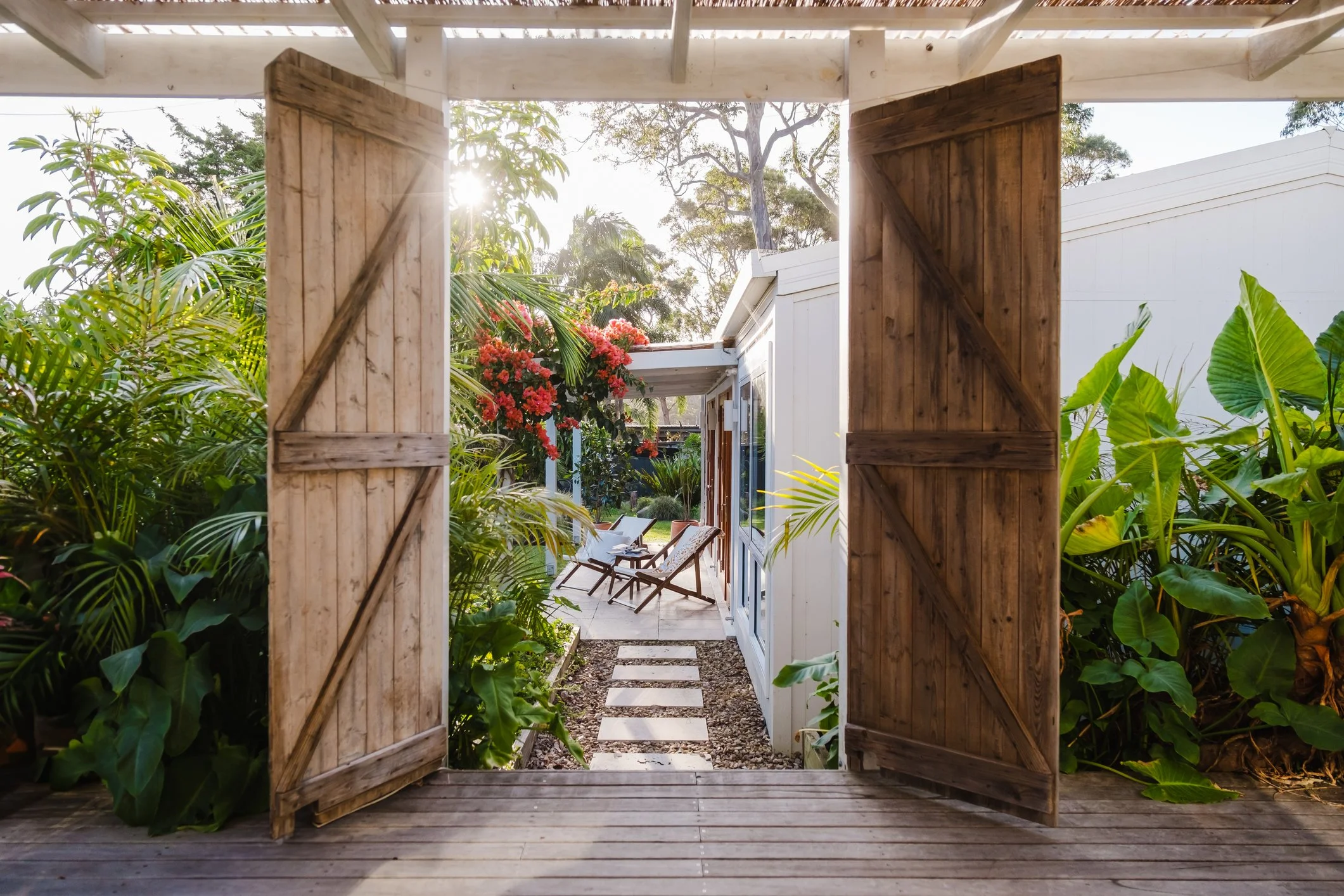 Welcoming patio with flowers and sunshine