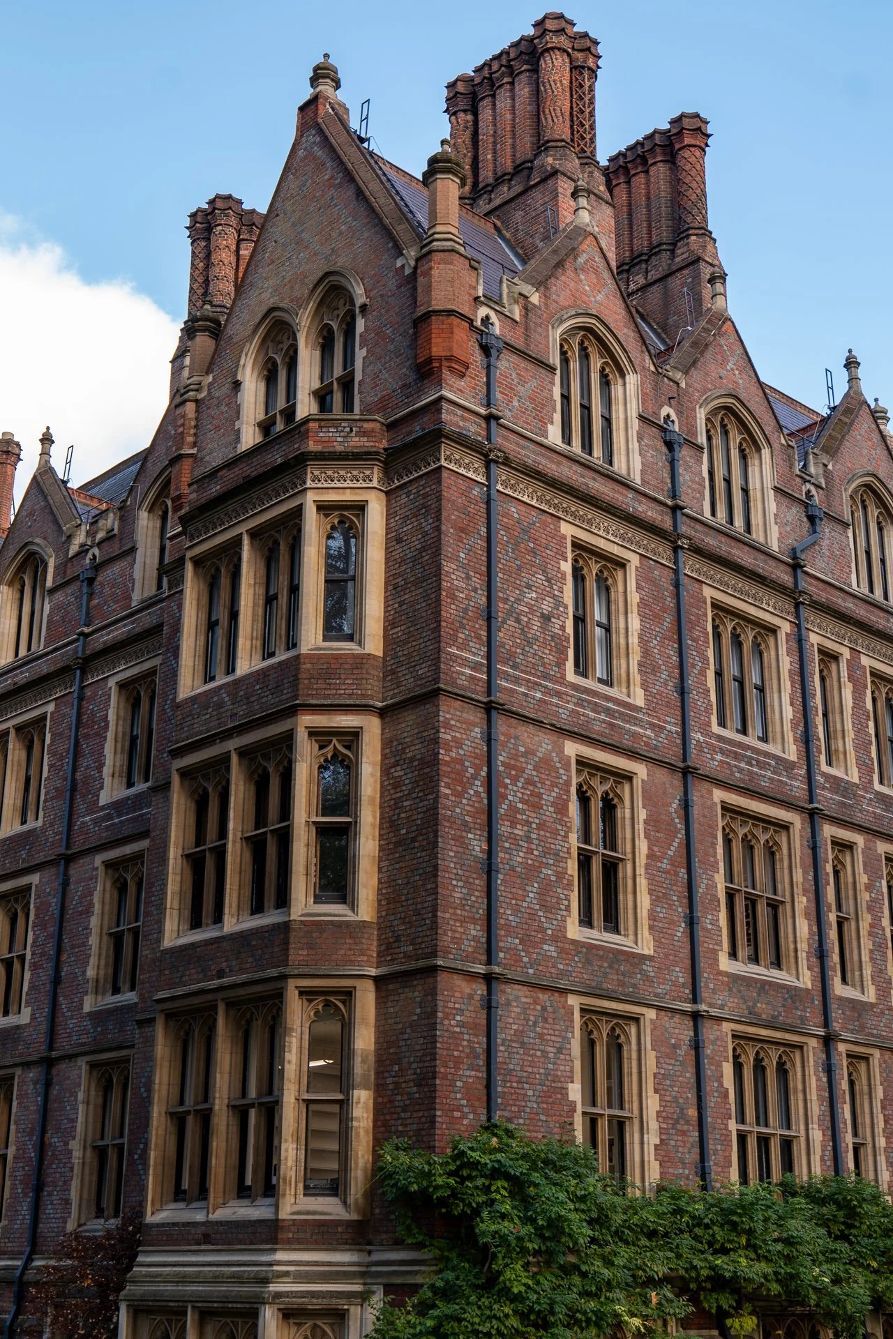 Victorian-style brick building with decorative windows and chimneys.