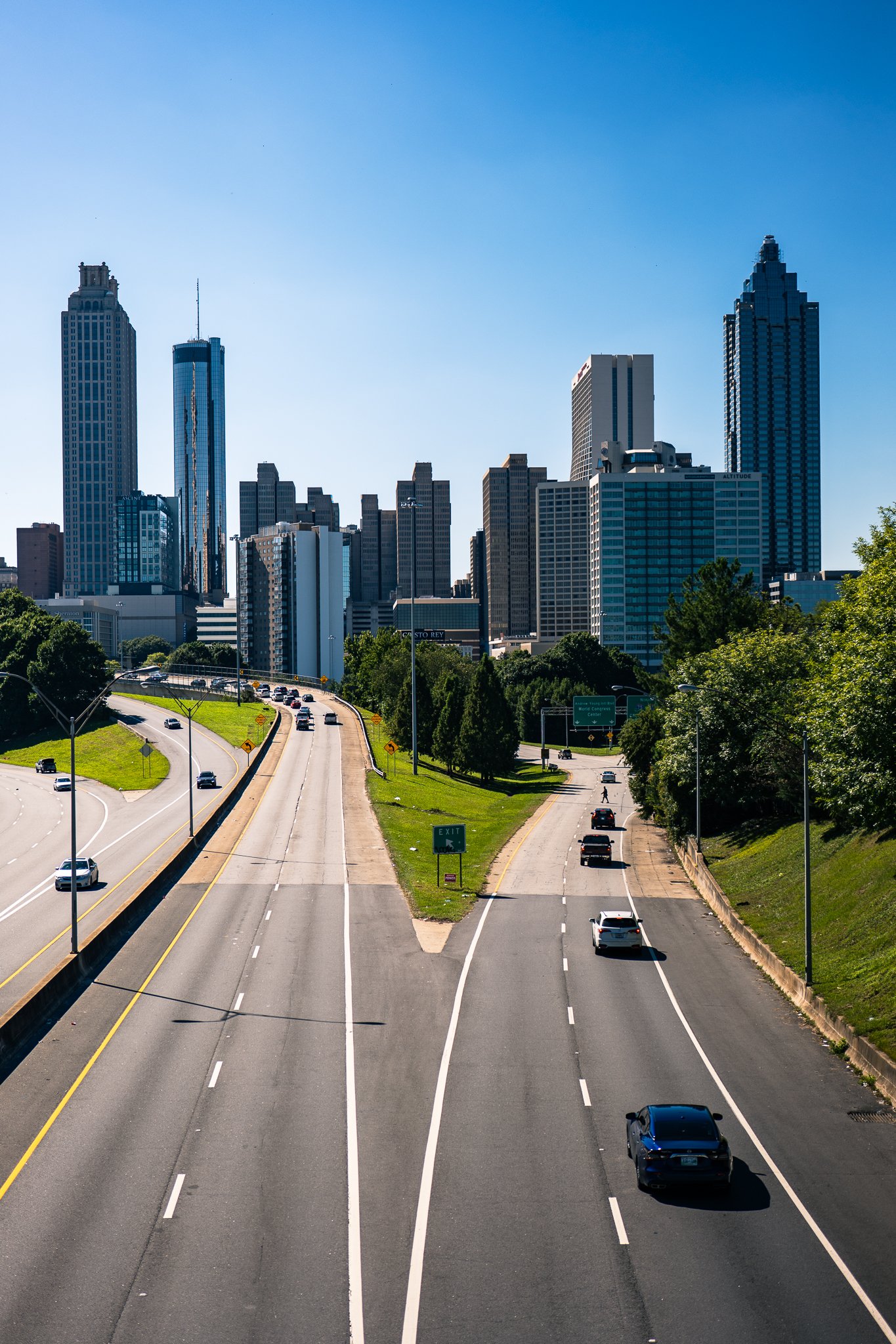 Atlanta skyline with highway in foreground, clear blue sky