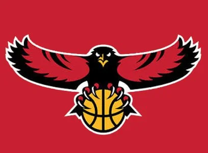 A black, red, and white eagle holding a basketball against a red background.