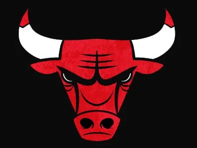 A stylized red bull's face with black and white horns on a black background.
