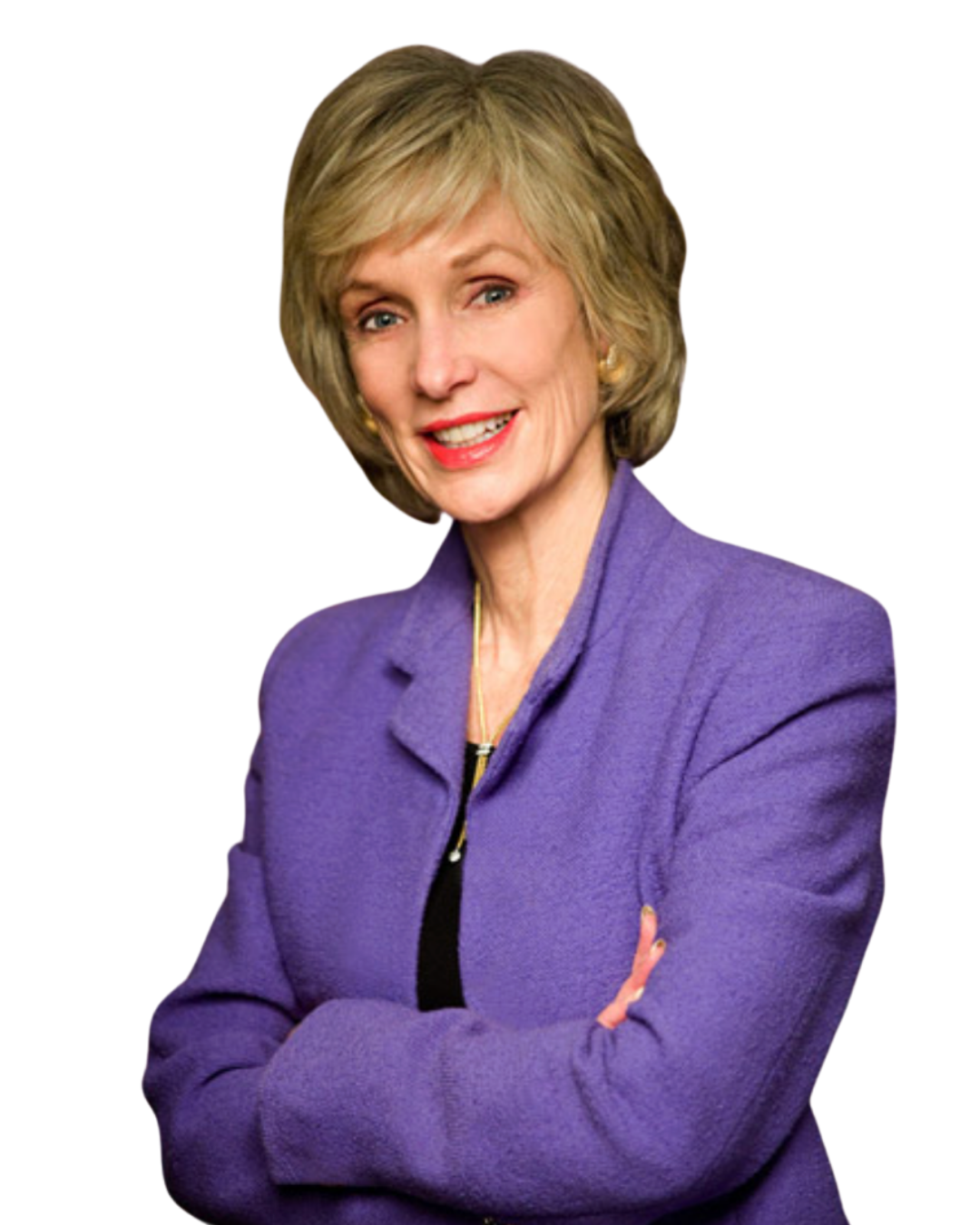 A woman wearing a purple blazer, with short blonde hair, smiling and with arms crossed.