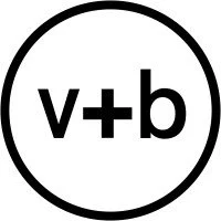Vegetable + Butcher's circular logo with a black border containing the letters 'v + b' in black on a white background.