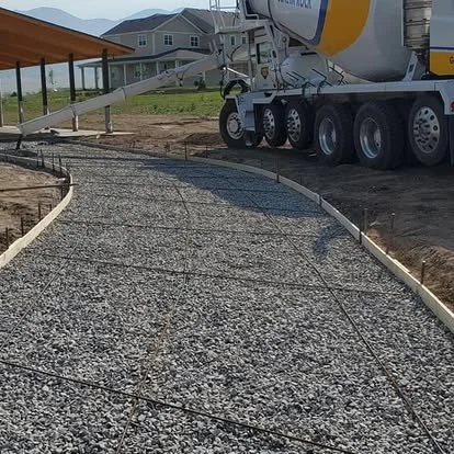 Walkway preparation with forms and gravel base in place before the concrete pour.