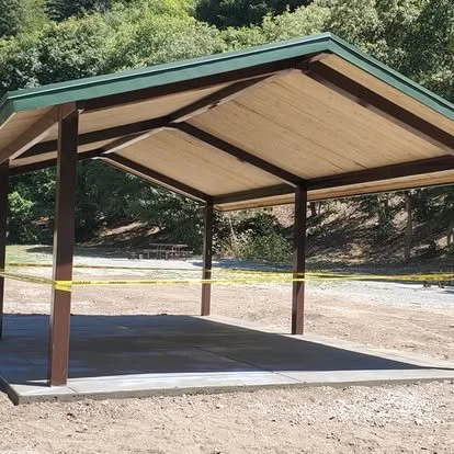 Finished concrete pad under a covered structure, creating a clean and functional outdoor surface.