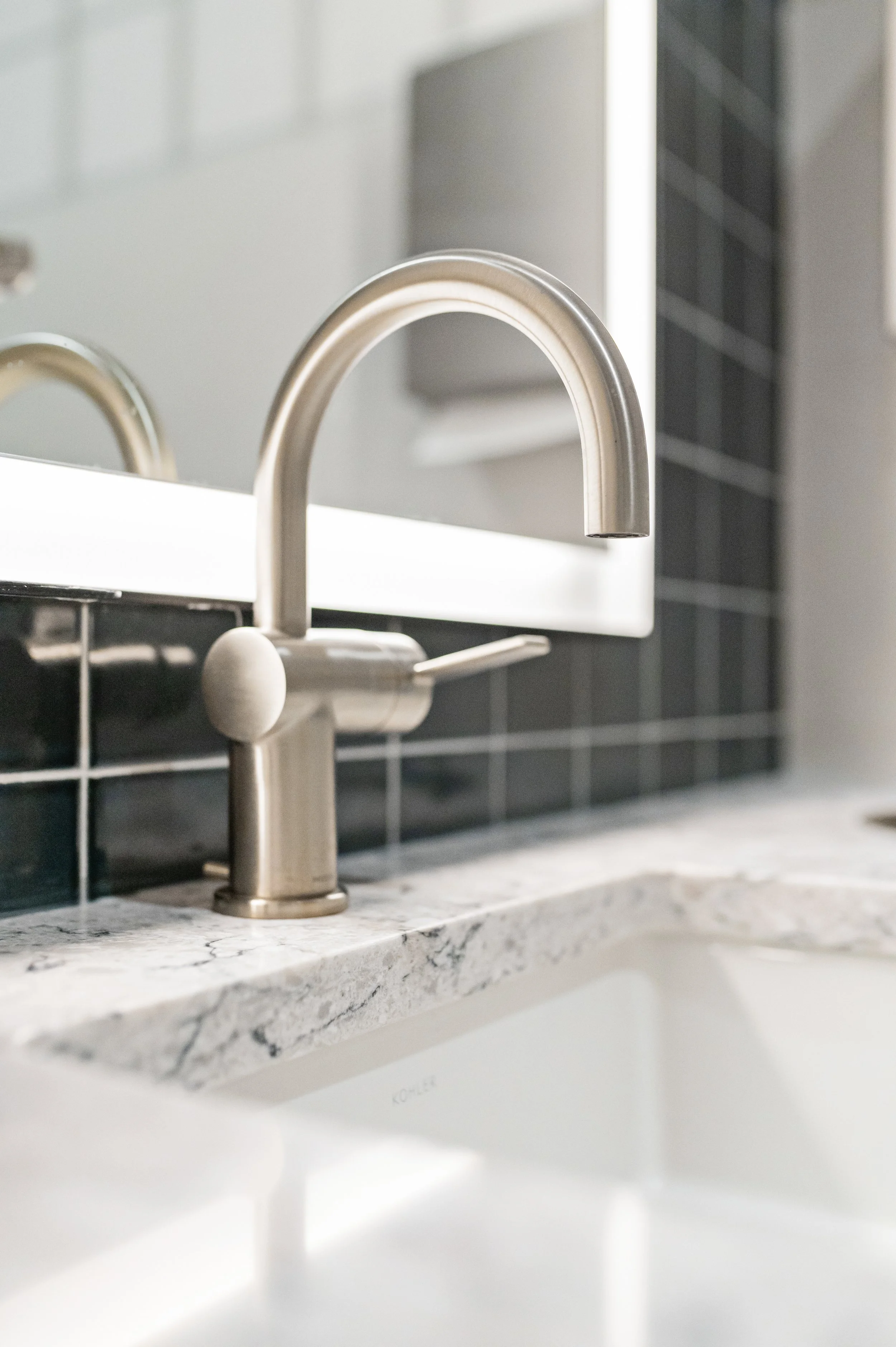 Western Insurance bathroom silver faucet accent details