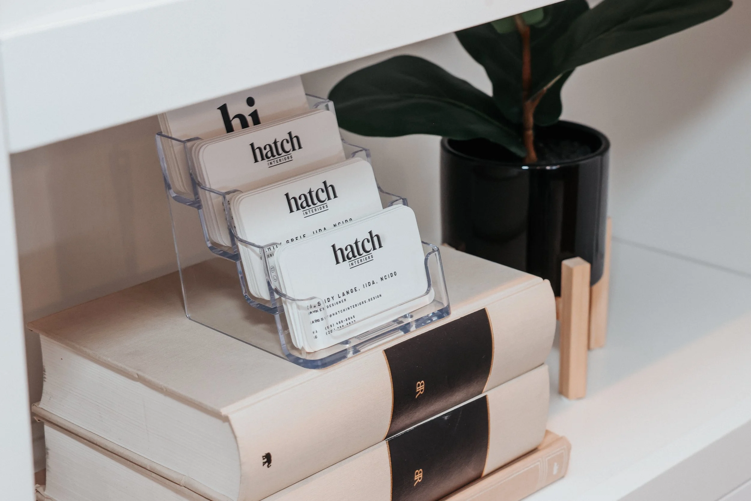 Hatch Interiors business card display at office space
