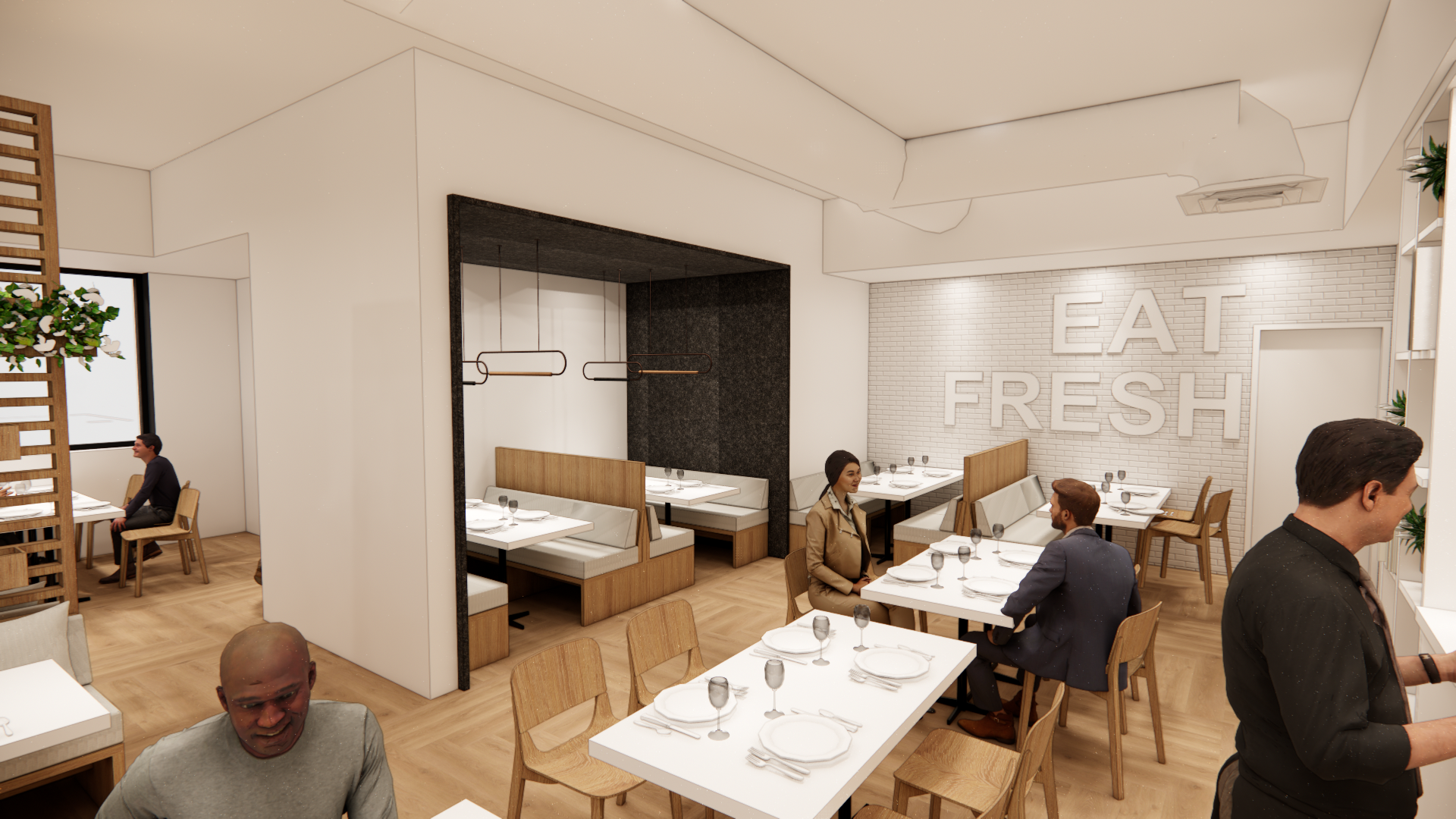 Interior of restaurant with wooden flooring, white walls, and a brick accent wall with large white letters saying "EAT FRESH."
