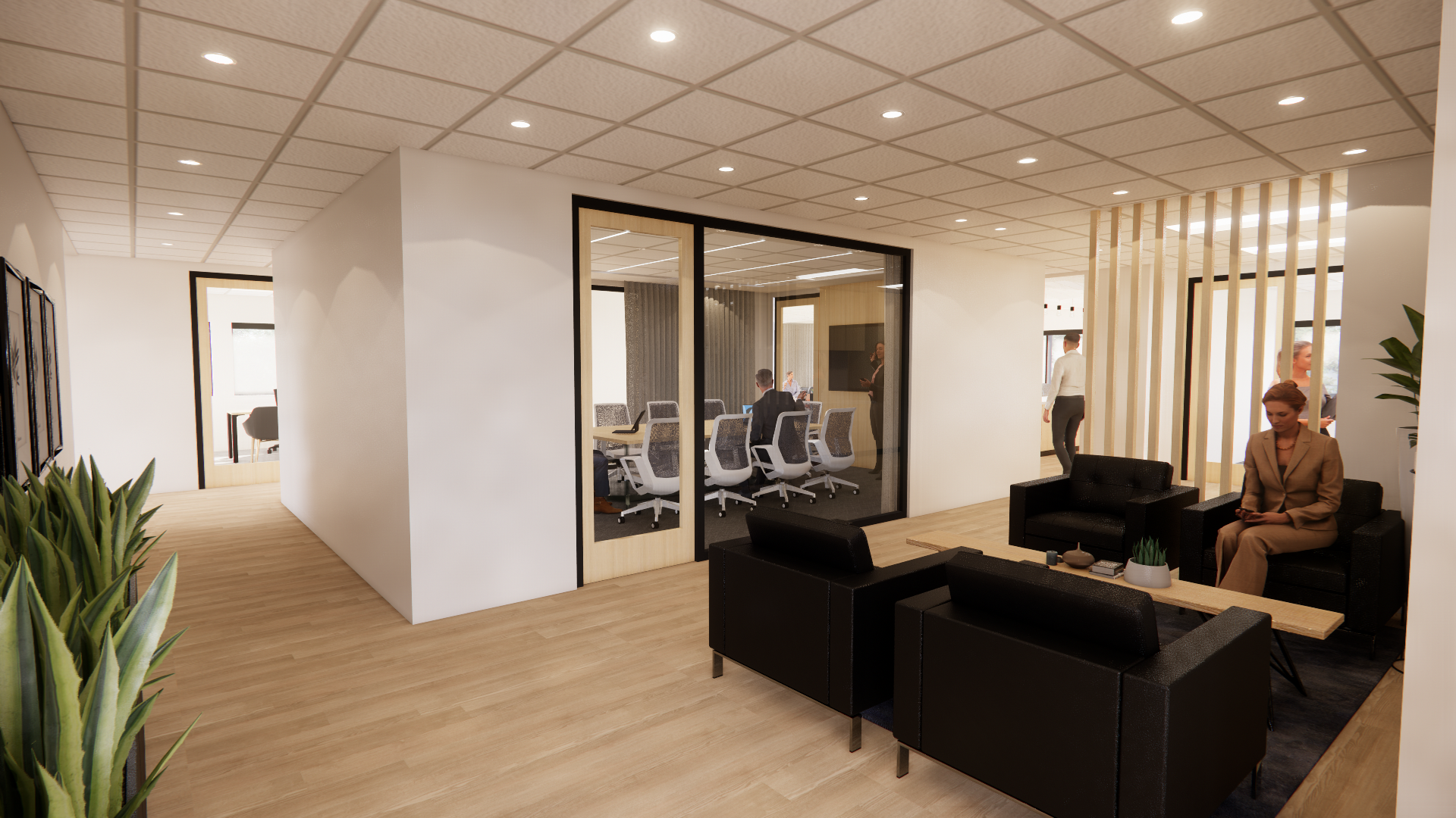 Office waiting area with comfortable chairs across from a glass doored meeting room