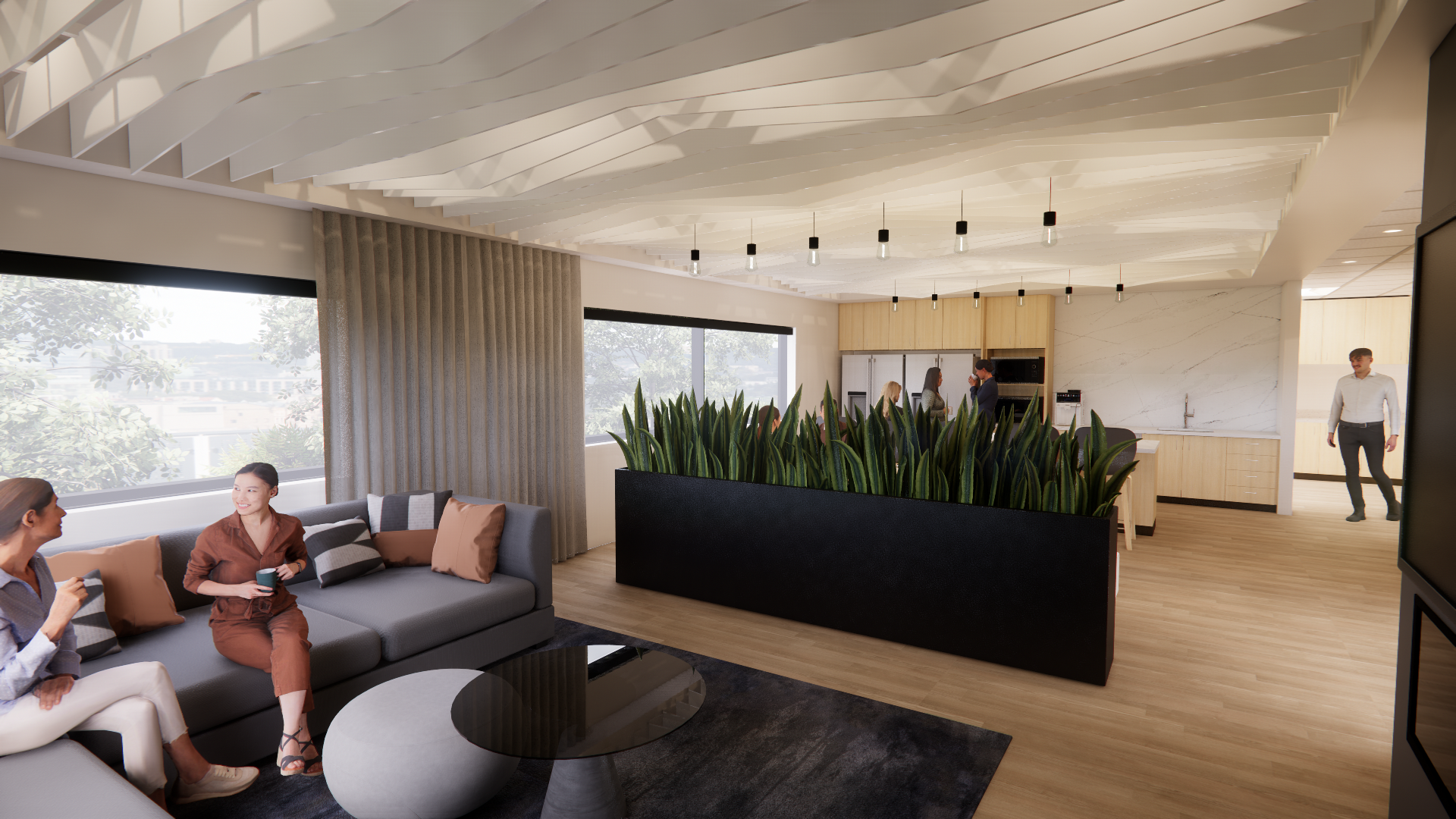 Office kitchen and living room with a large planter separating the two