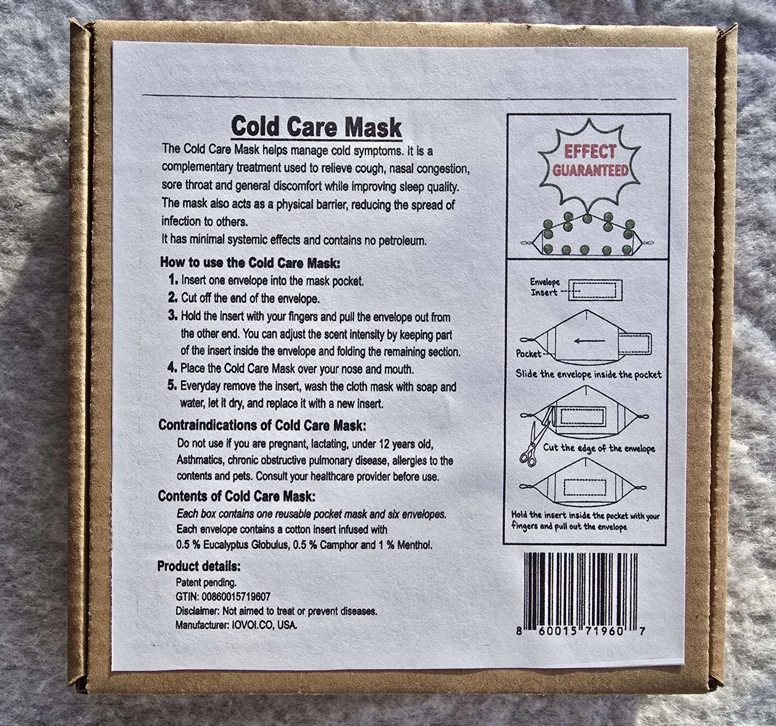 The image shows the back side of a box of cold care masks with written instructions and diagrams for use. The box is made of cardboard and placed on a gray textured surface.