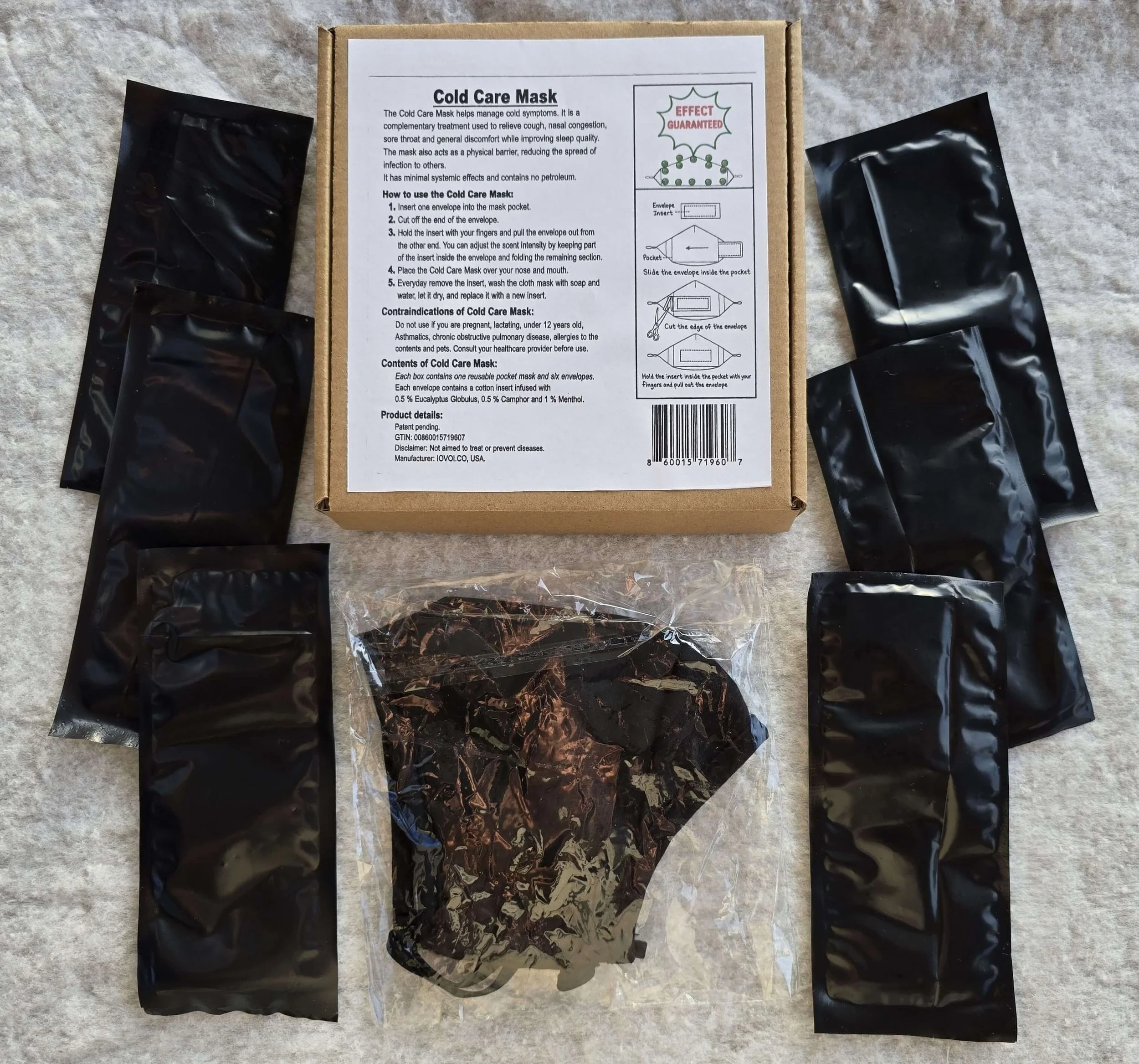 A box of Cold Care Masks with six black envelopes and a detailed instruction sheet.