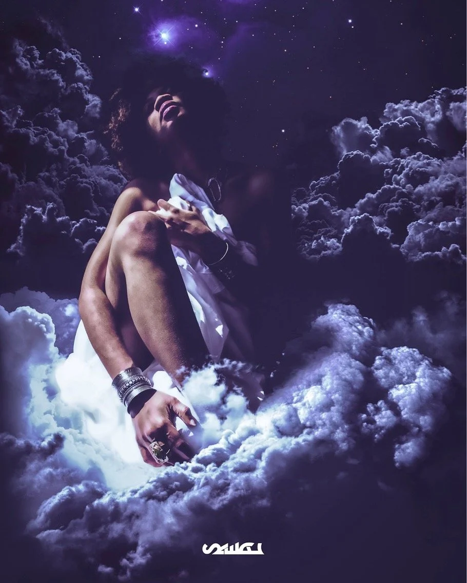 A woman with jewelry, sitting amidst clouds and stars in a night sky, smiling and laughing.