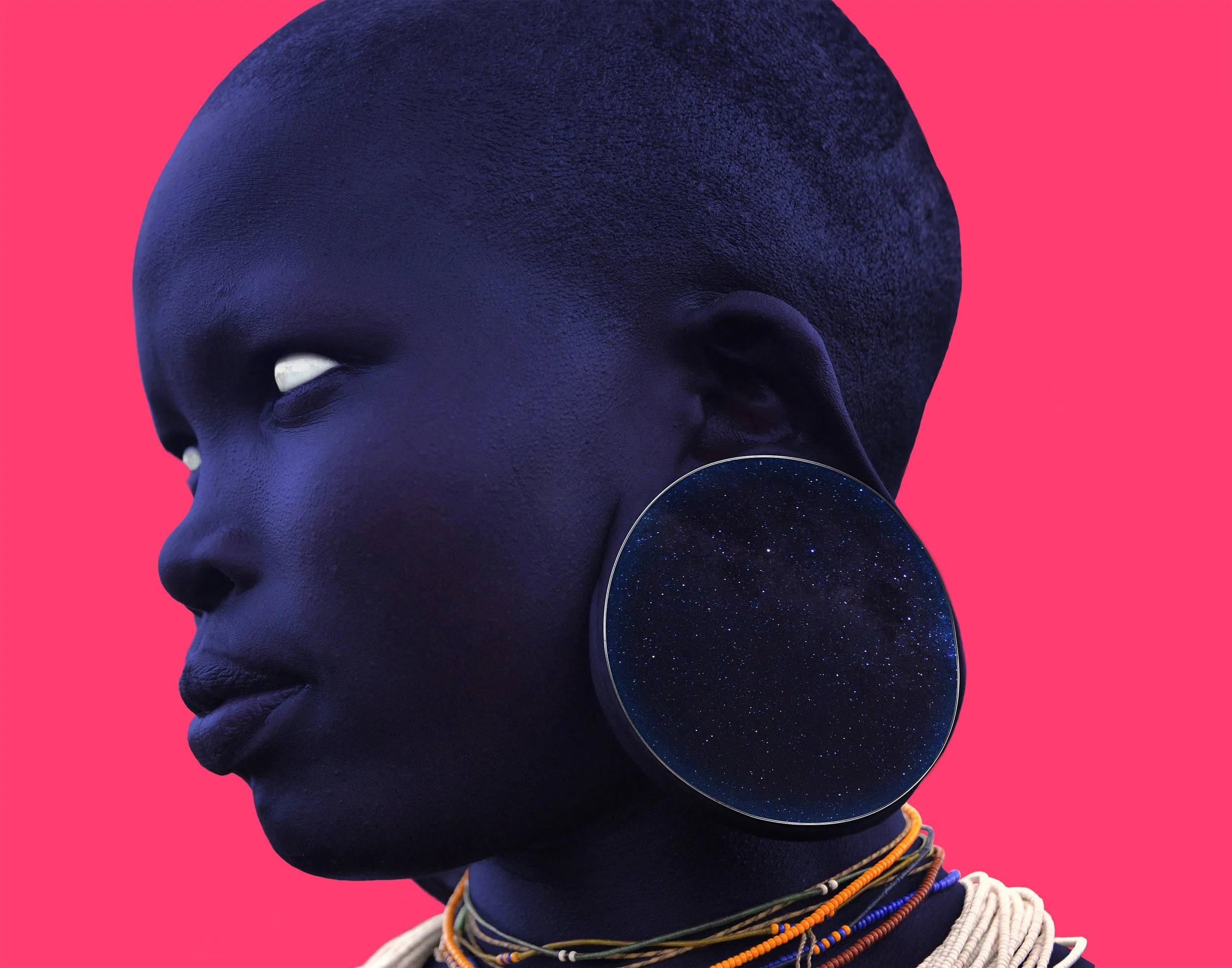 Close-up of a woman with dark blue skin and a large, textured head against a pink background, wearing a large ear gauge and beaded necklaces.