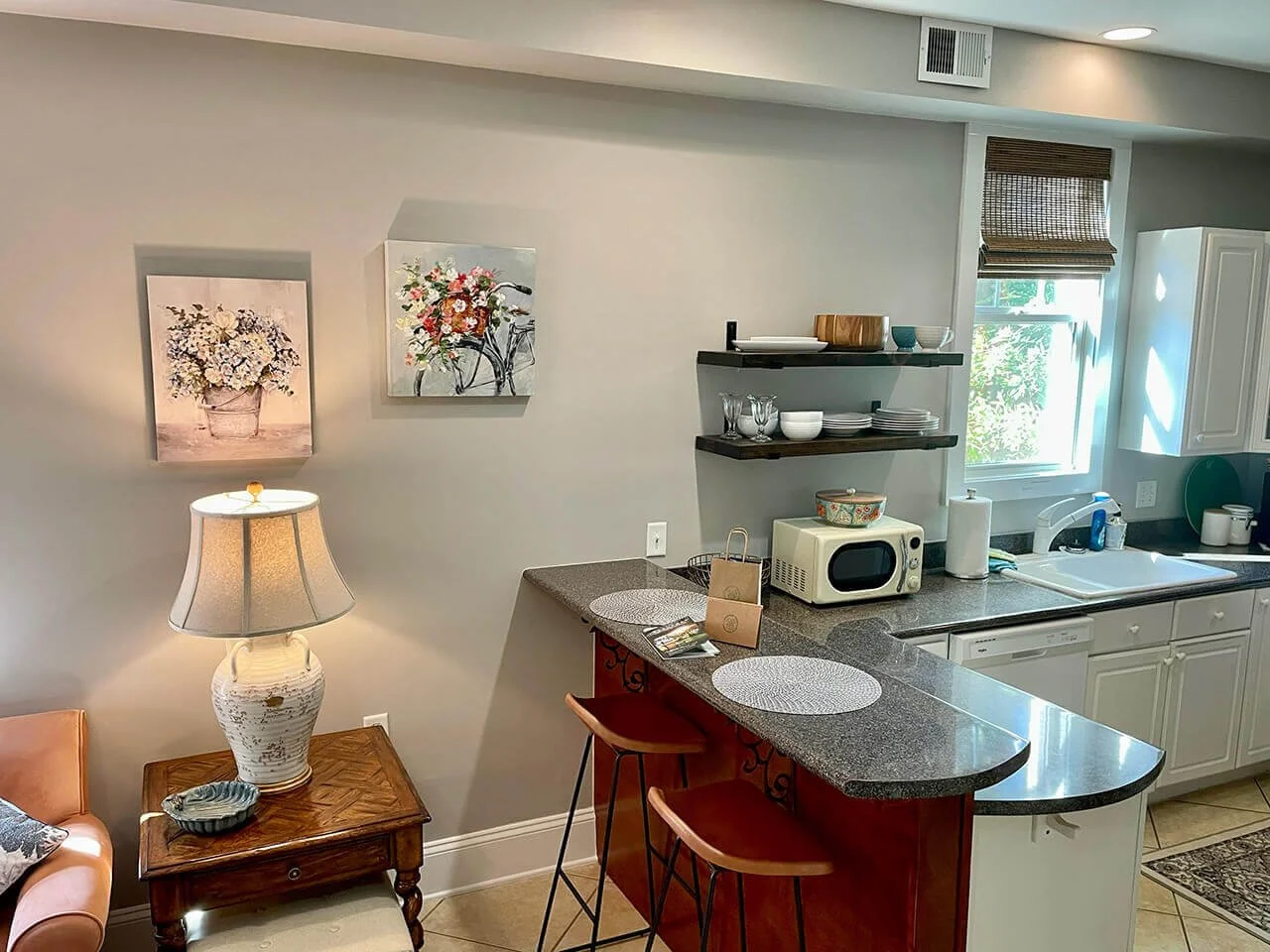 Open living room and kitchen area at Camellia Suite