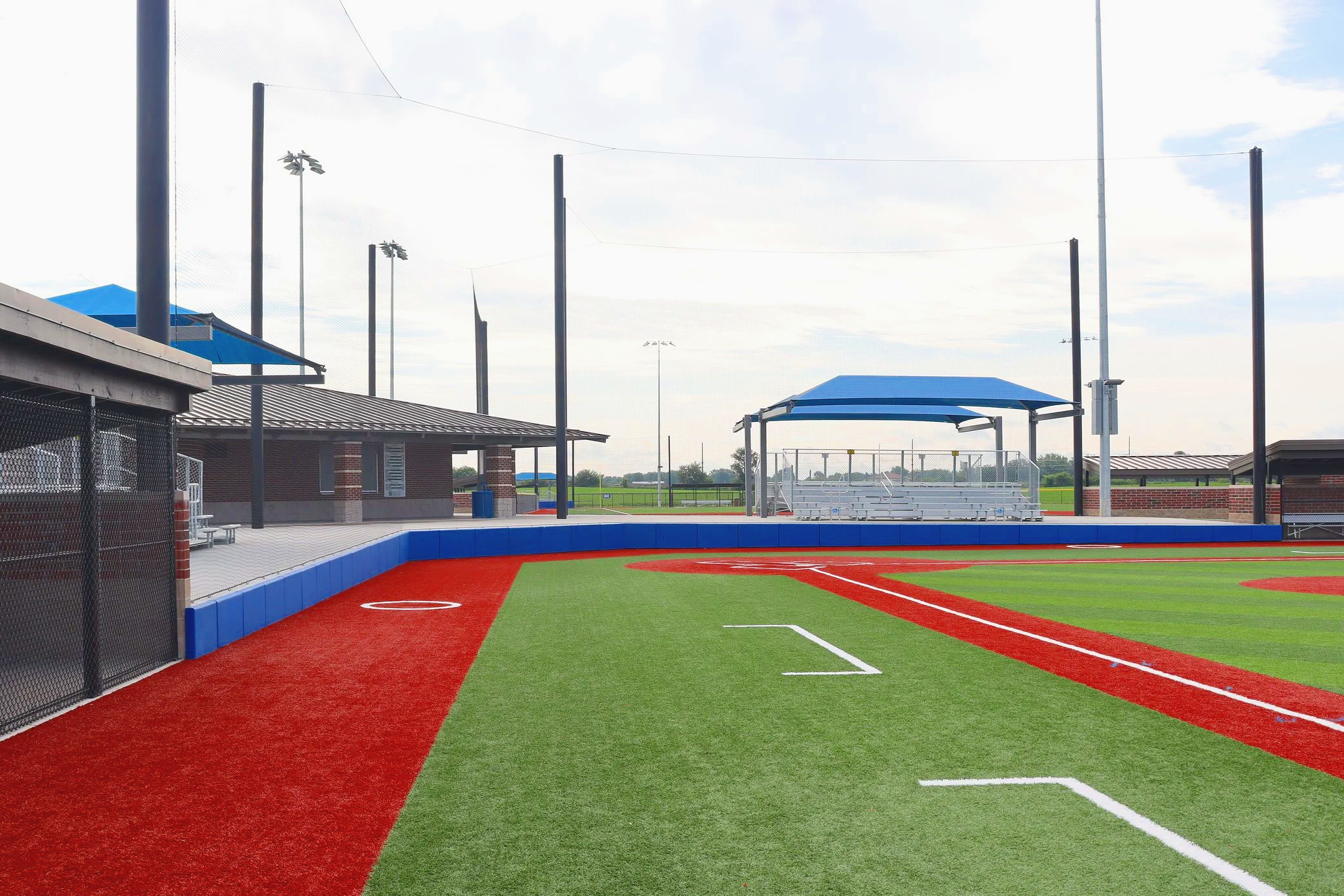 Your field needs padding along the fence, shade over your players and spectators, and netting protecting every boundary. USS supplies all three from one supplier — as seen here at Plummer Park, where every product on the field came from USS.
