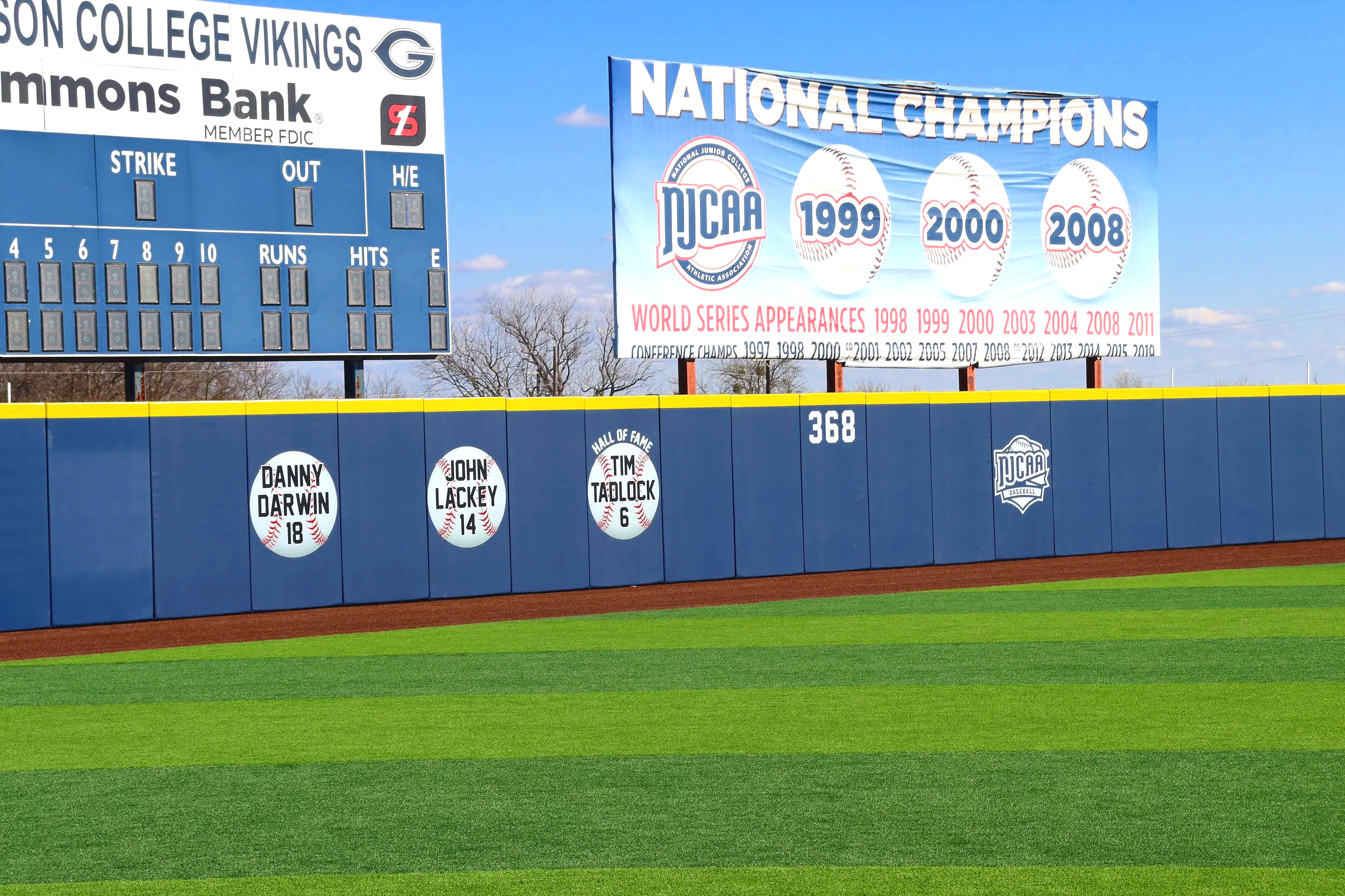 Designed for Safety. Built for Champions. — Exterior wall padding at Grayson College Vikings baseball field in Texas by Unlimited Sports Solutions.