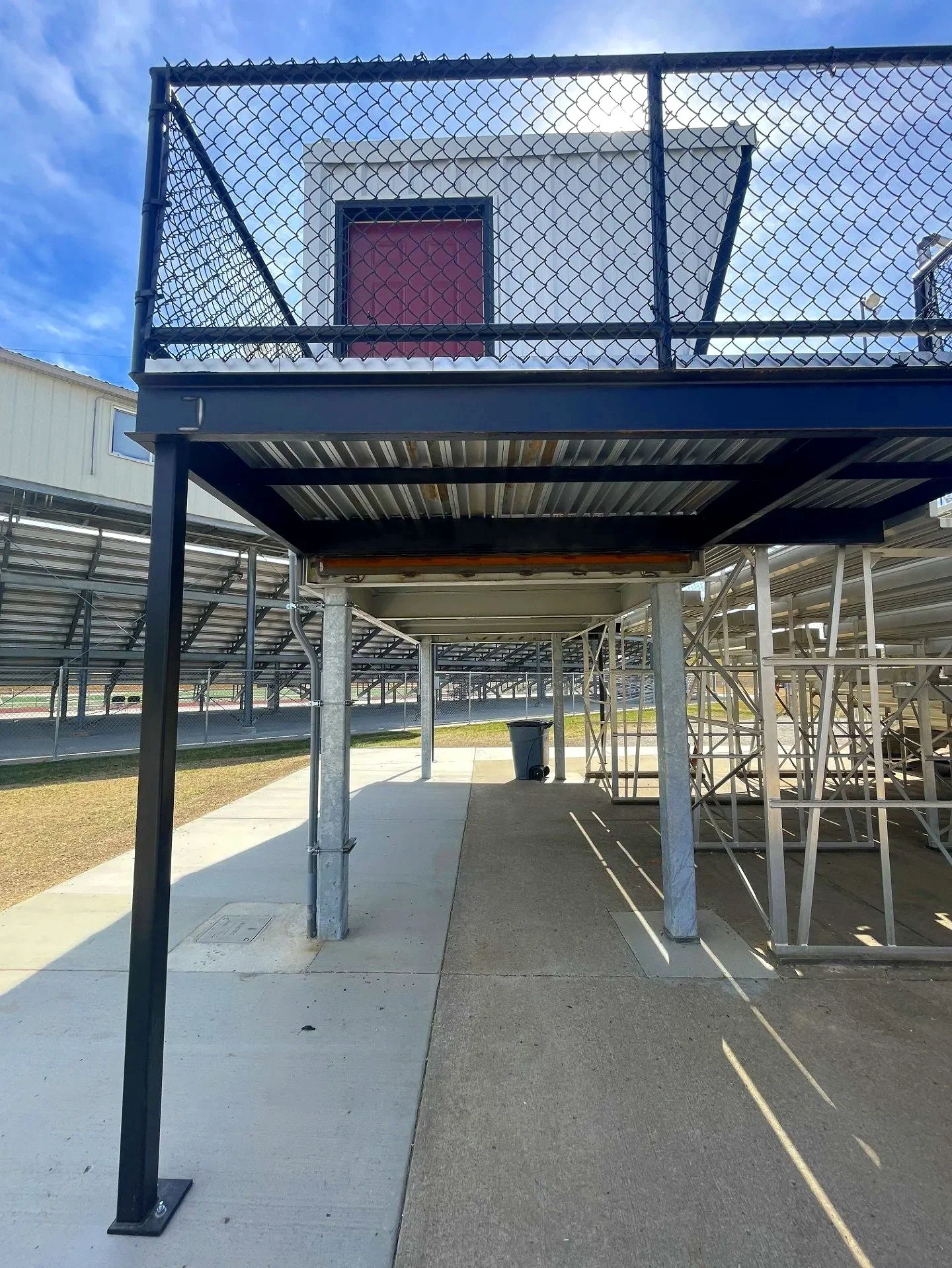 The USS press box elevated on a structural platform above the grandstand at Waverly High School in Waverly, Nebraska — professional press box installation built to the same standard as everything else USS supplies, from the foundation up. Supplied by