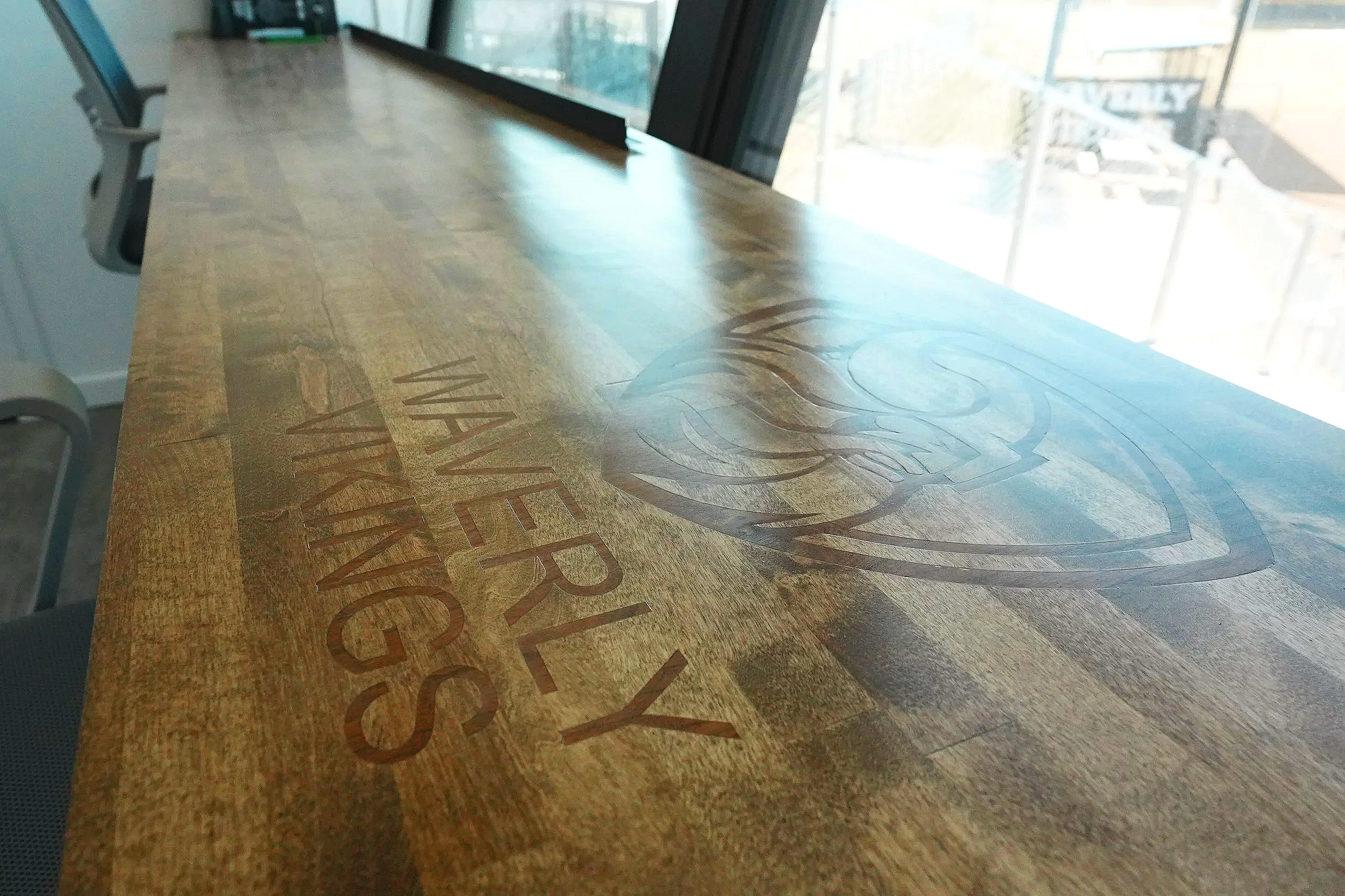 A wide angle view of the custom branded Waverly Vikings wood counter inside the USS press box at Waverly High School — professional press box construction built down to every last detail, right here in Waverly, Nebraska. Supplied by Unlimited Sports 