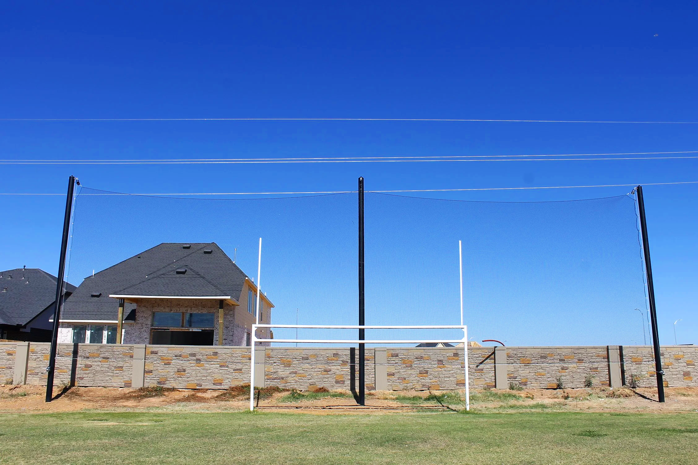 Most facilities think about netting on their backstop and foul lines. The best facilities think about every space athletes and spectators share. USS supplies netting solutions for both — including overhead systems for complex common areas like this o