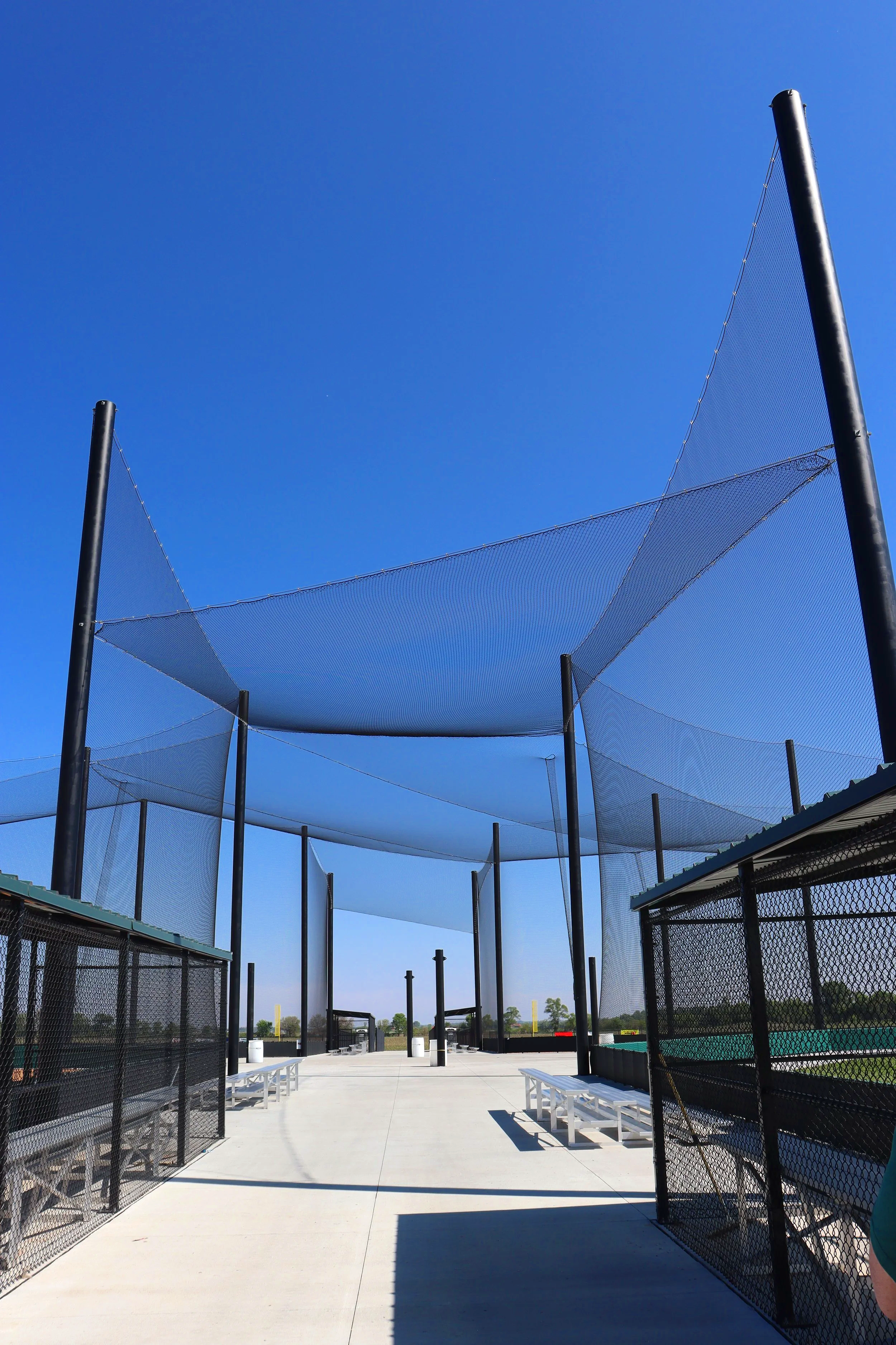 Most facilities think about netting on their backstop and foul lines. The best facilities think about every space athletes and spectators share. USS supplies both — including this overhead barrier netting system installed right here in Nebraska.