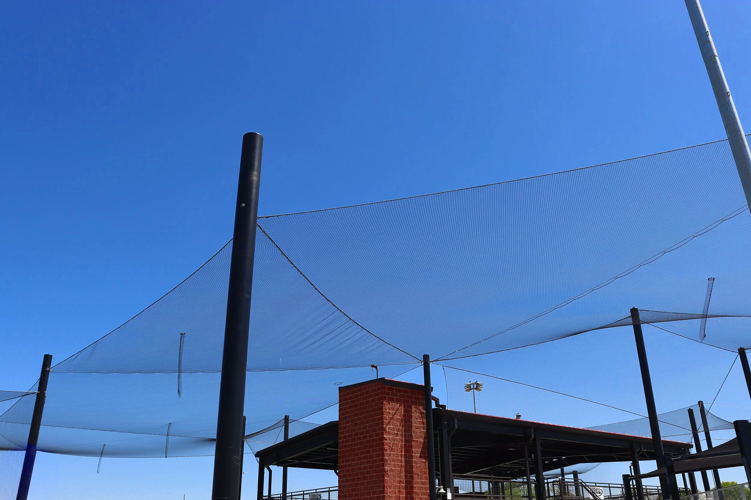 Your backstop protects home plate. Your foul line netting protects the lines. But who is protecting the space above your facility? USS overhead barrier netting systems cover the angles most facilities overlook — at any scale, for any complex.
