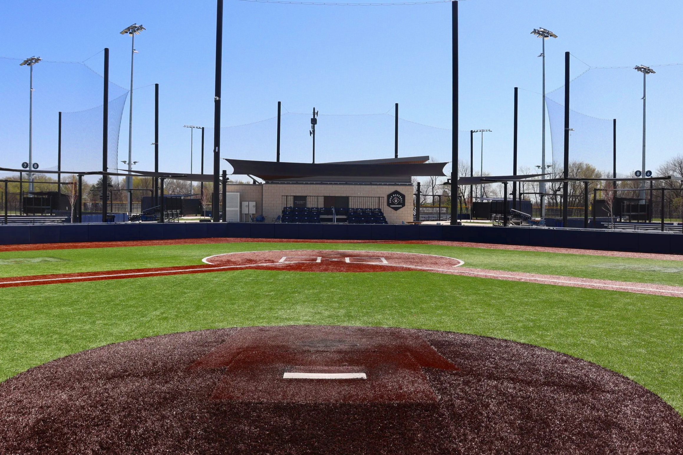 Portable pitching mound at HomeField baseball complex, Kansas City with press box and field lighting