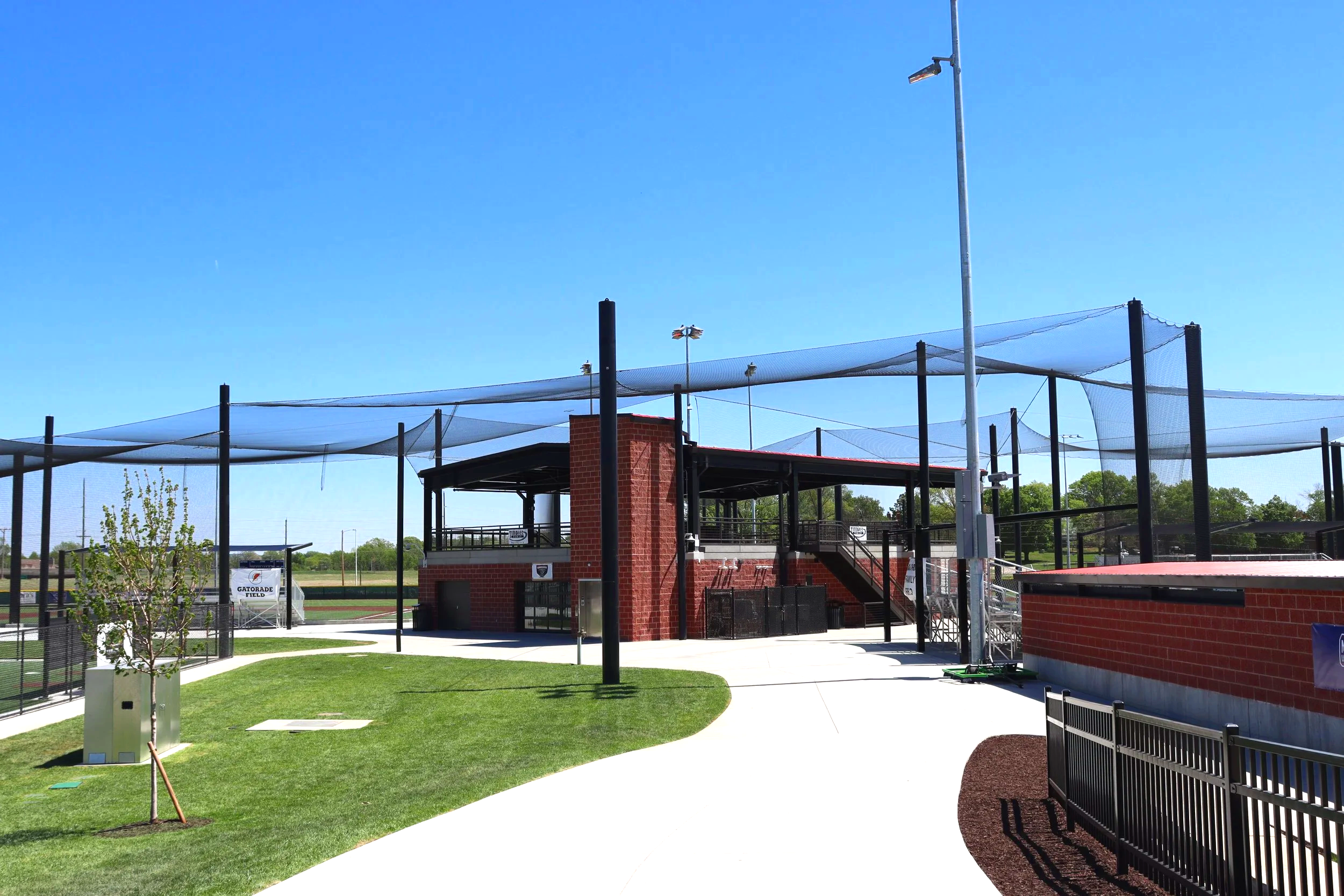 Shade structure and batting cage netting at Cico Park baseball facility in Manhattan Kansas