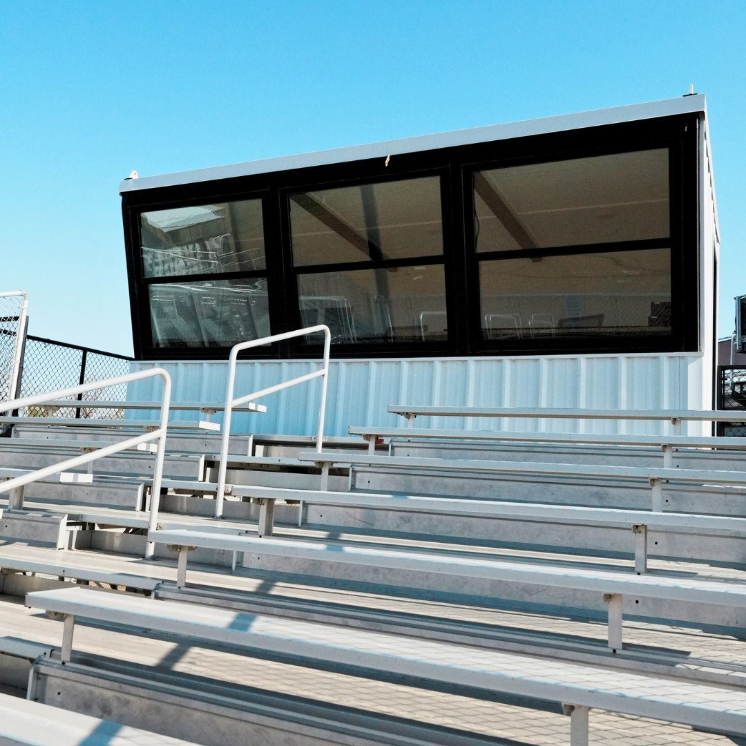 Prefabricated press box with glass windows and bleacher seating at Waverly High School in Waverly Nebraska