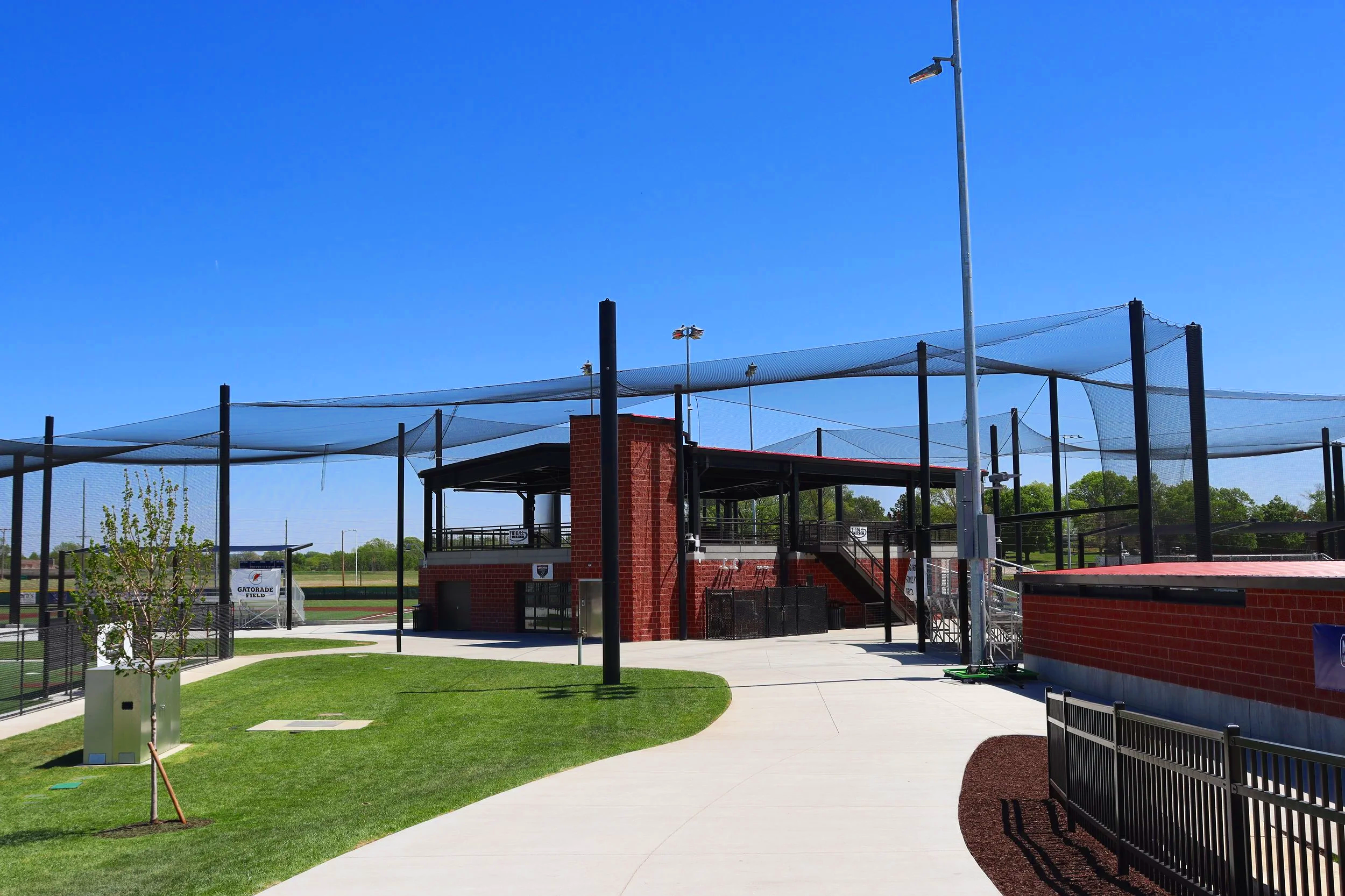 Overhead barrier netting system and batting cages at Cico Park baseball complex in Manhattan Kansas