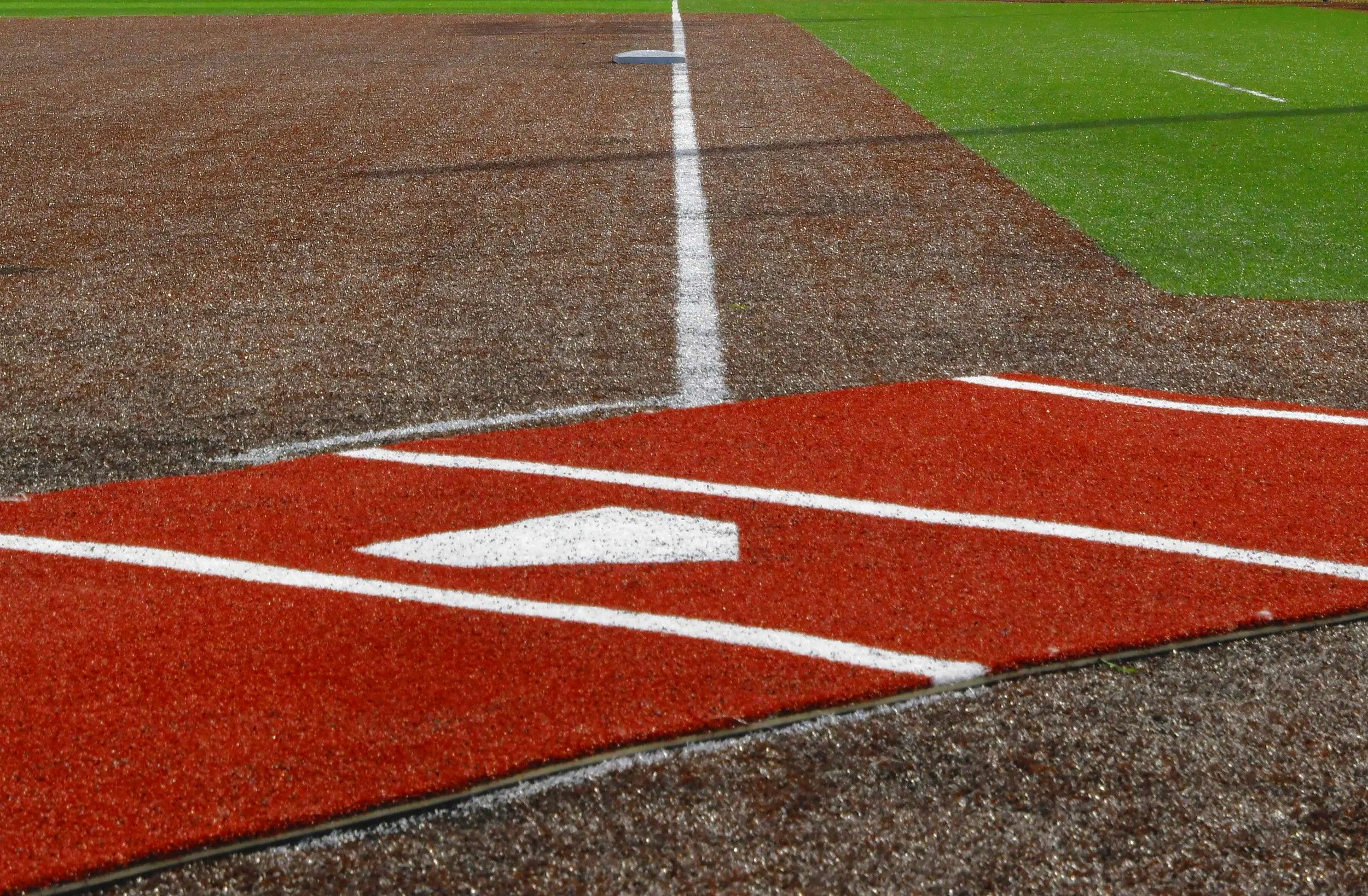 Home plate and batter's box on baseball infield with turf and clay surface — USS sports field maintenance equipment and field armor panels supplier for baseball and softball athletic facilities
