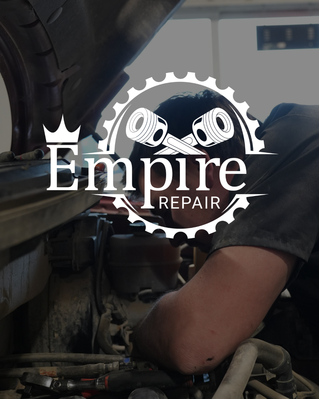Empire Repair logo over mechanic performing automotive repair