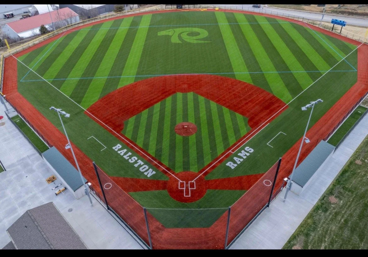 Aerial view of Ralston High School Rams baseball field with custom turf logo and infield design