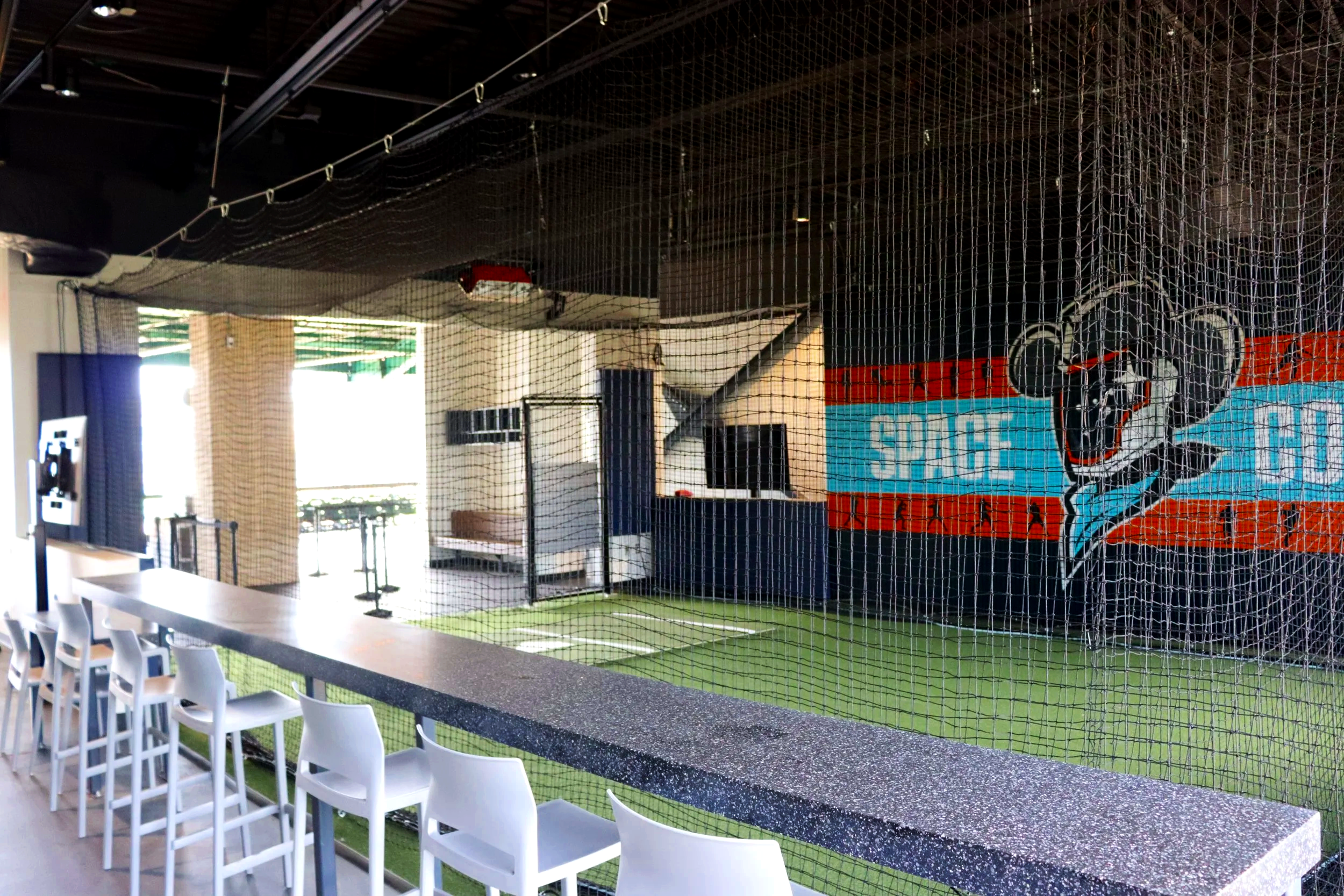 Indoor baseball training facility with batting cages and turf at Constellation Field Sugar Land Texas