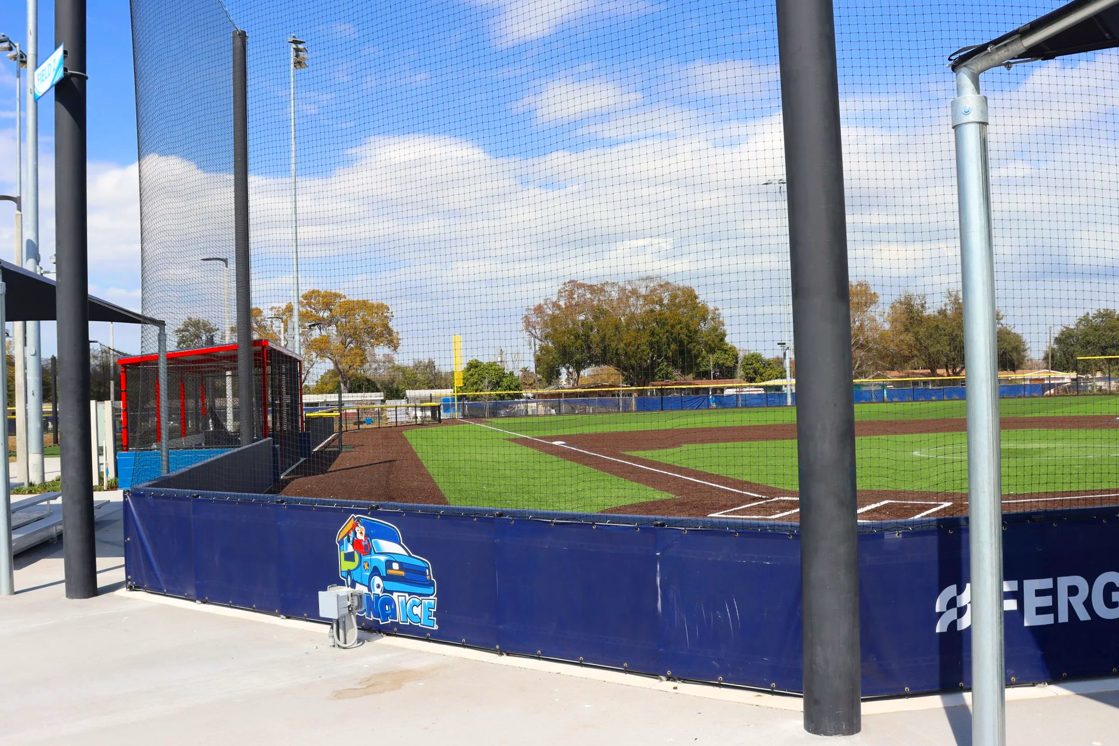 Custom branded fusion wall windscreen with advertisment for baseball field at Sprowls Horizon in Pinellas Park, Florida
