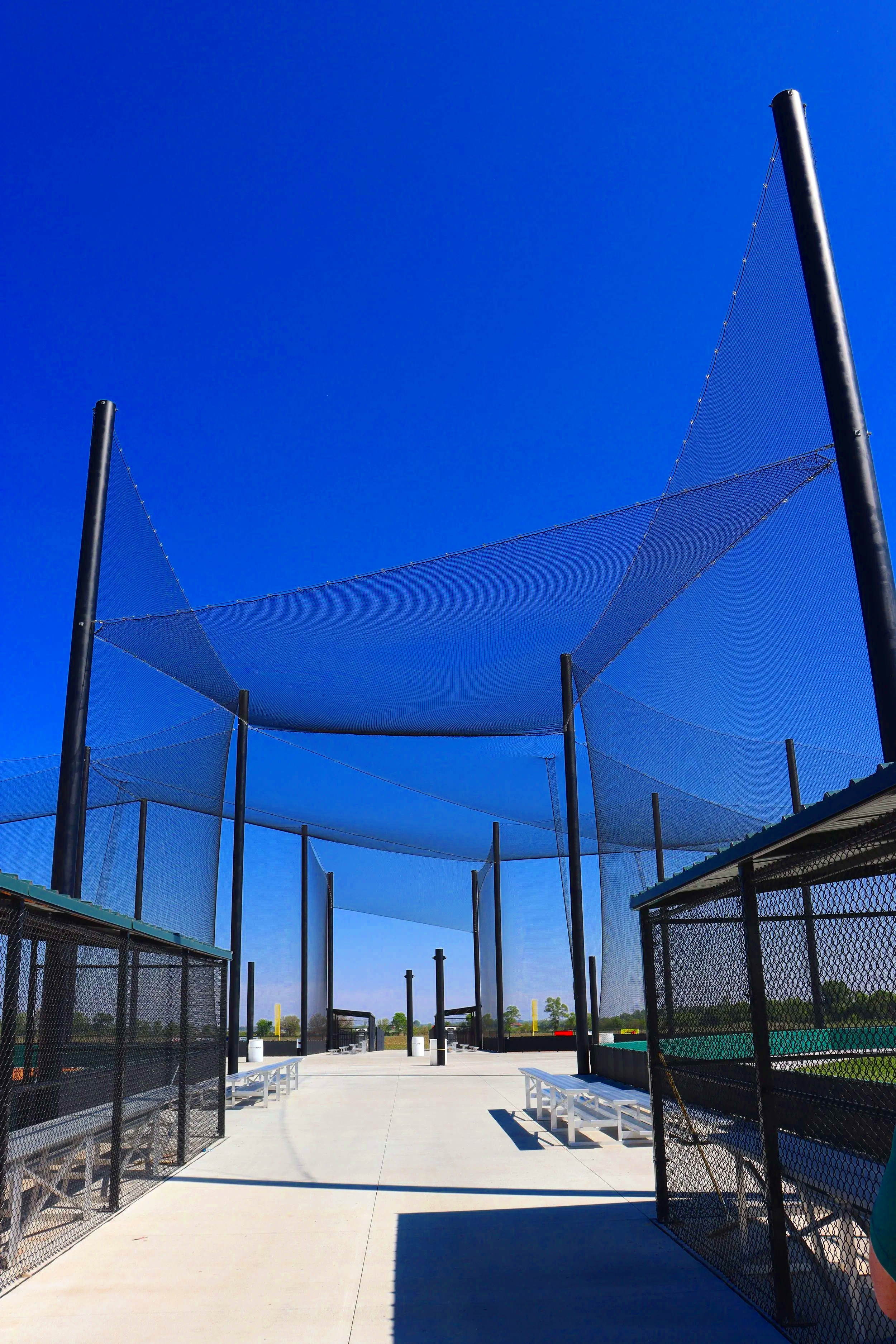 Canopy netting system along foul line and dugout area at Elkhorn Athletic Association in Elkhorn Nebraska