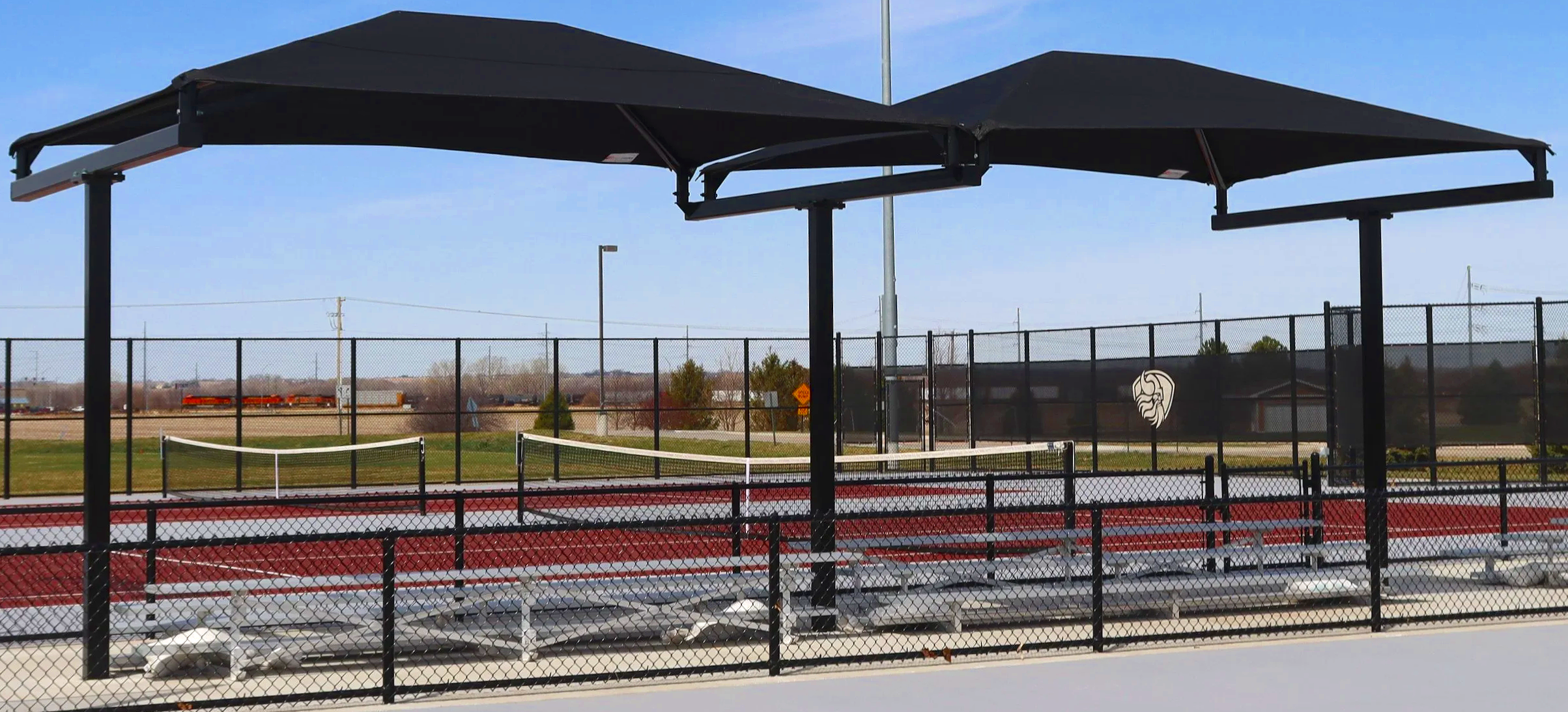 Hip shade structures over tennis courts at Waverly High School, Waverly, Nebraska