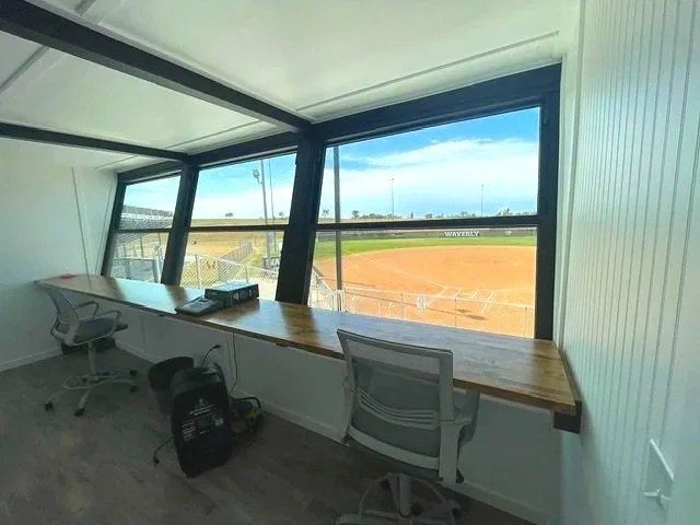 Interior view of USS press box with panoramic windows overlooking softball field at Waverly High School in Waverly Nebraska — USS baseball press box supplier for high school athletic programs