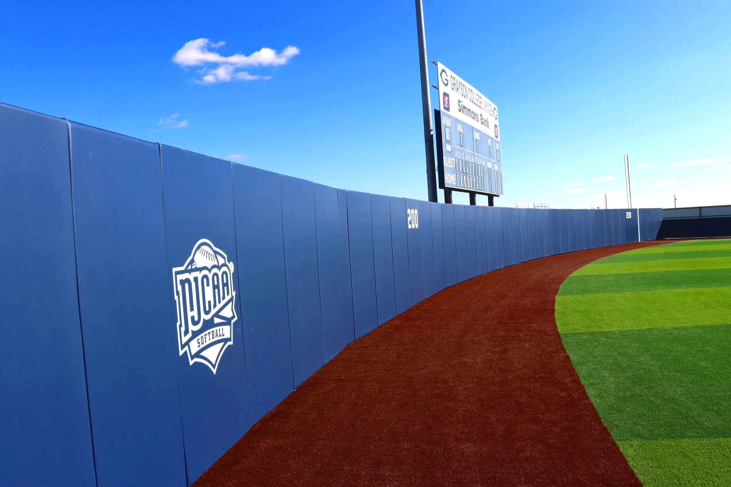 NJCAA branded outfield wall padding at Greyson College baseball facility