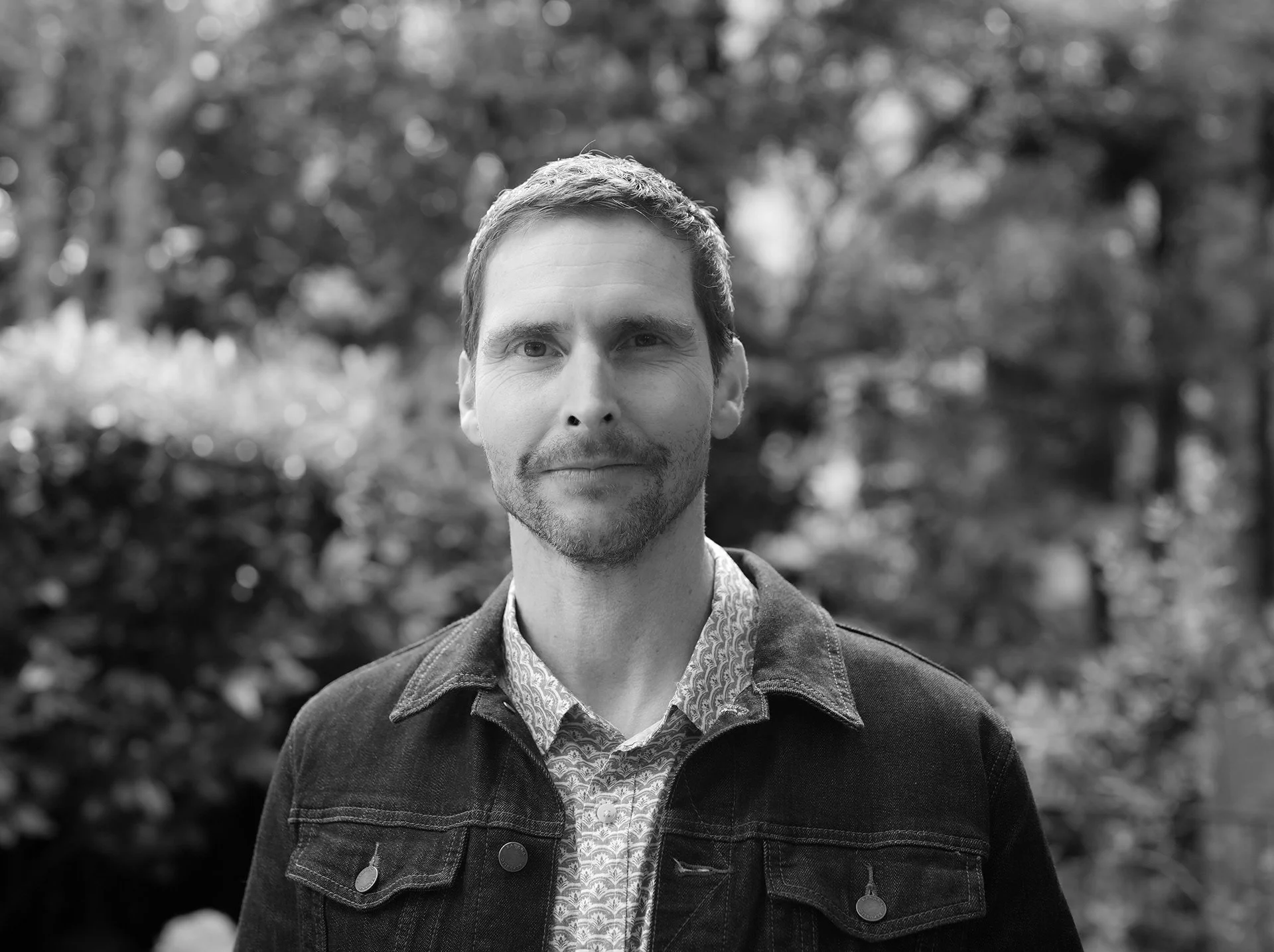 Black and white photo of creative director and founder, Jeff Pizzo.