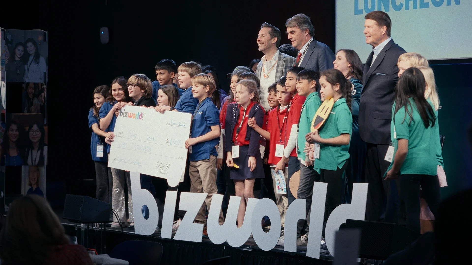 People on stage at a Bizworld fundraiser event in Mountain View, CA