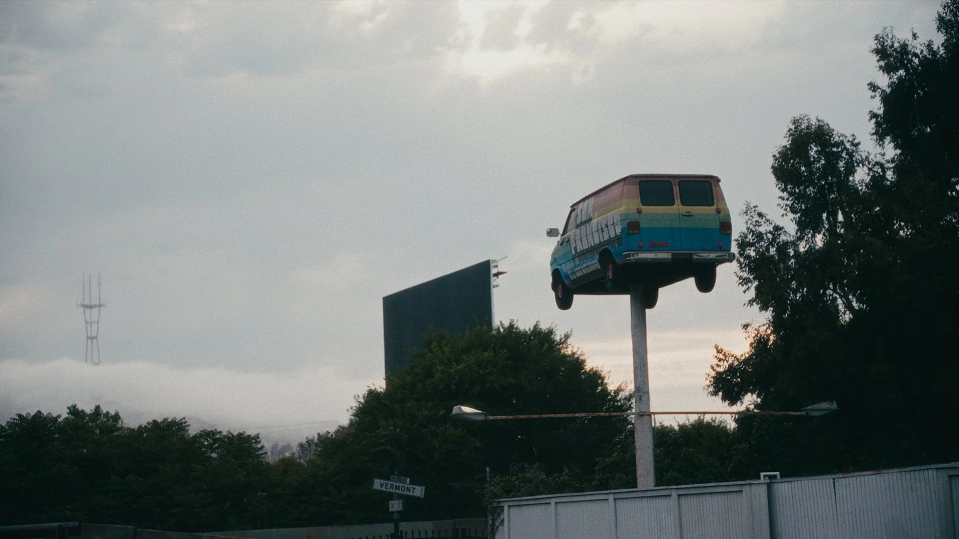 View of the sky with a van that says, "San Francisco" on the side