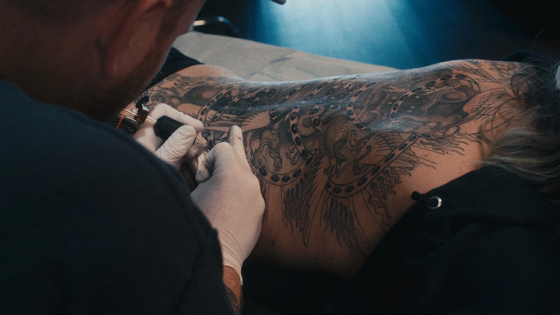 Tattoo artist working at Eye of The Tiger Tattoo shop in San Francisco, CA