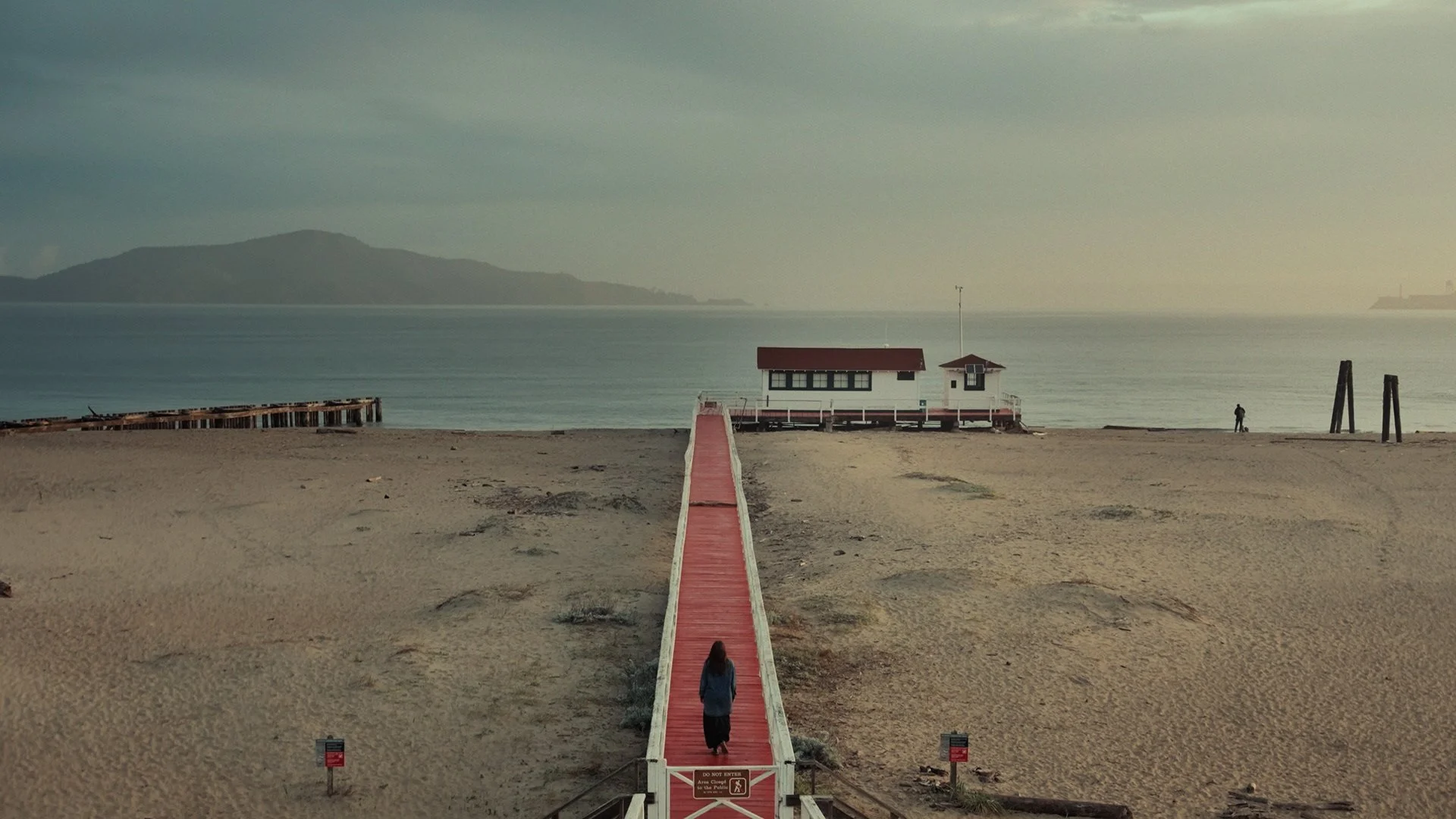 Artist Diane Dallas-Kidd walking on a pier in San Francisco, CA