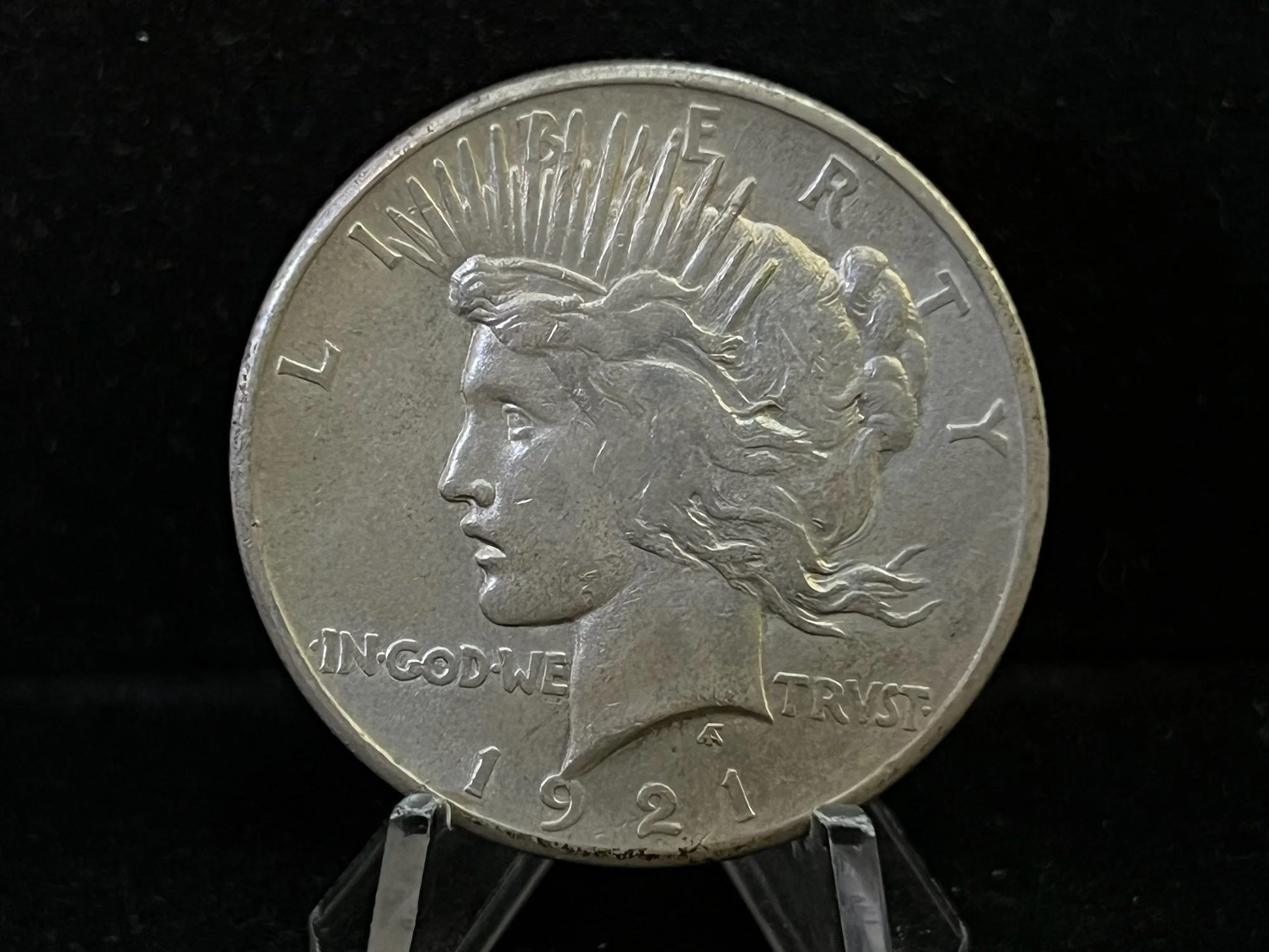 A US dime coin from 1992 featuring a profile of Lady Liberty with a feathered headdress.
