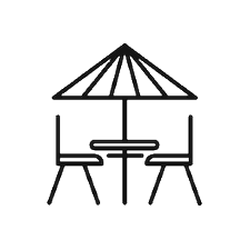 Outdoor patio table with two chairs and a large umbrella