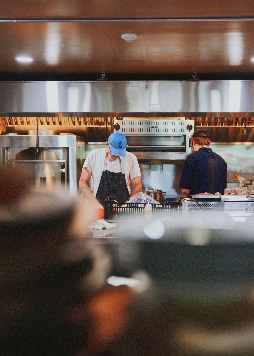 Chef Tom Ellis and the kitchen team preparing food at The Tavern at Liberty Farms